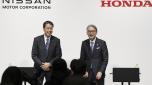 FILE - Nissan Chief Executive Makoto Uchida, left, and Honda President Toshihiro Mibe attend a joint news conference in Tokyo, Friday, March 15, 2024. (Kyodo News via AP, File)