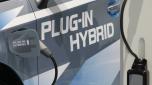 FILE -The plug to charge the batteries is plugged-in in a Toyota Prius Plug-In Hybrid on the first press day of the Frankfurt Auto Show in Frankfurt, Germany, Sept. 15, 2009. (AP Photo/Thomas Kienzle, File)