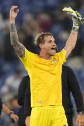 Lazio's goalkeeper Ivan Provedel celebrates at the end of a Champions League group E soccer match between Lazio and Atletico Madrid, at Rome's Olympic Stadium, Tuesday, Sept. 19, 2023. (AP Photo/Andrew Medichini)