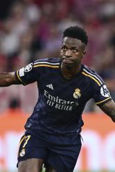 Real Madrid's Vinicius Junior celebrates after scoring his side's second goal on a penalty kick during the Champions League semifinal first leg soccer match between Bayern Munich and Real Madrid at the Allianz Arena in Munich, Germany, Tuesday, April 30, 2024. (AP Photo/Christian Bruna)