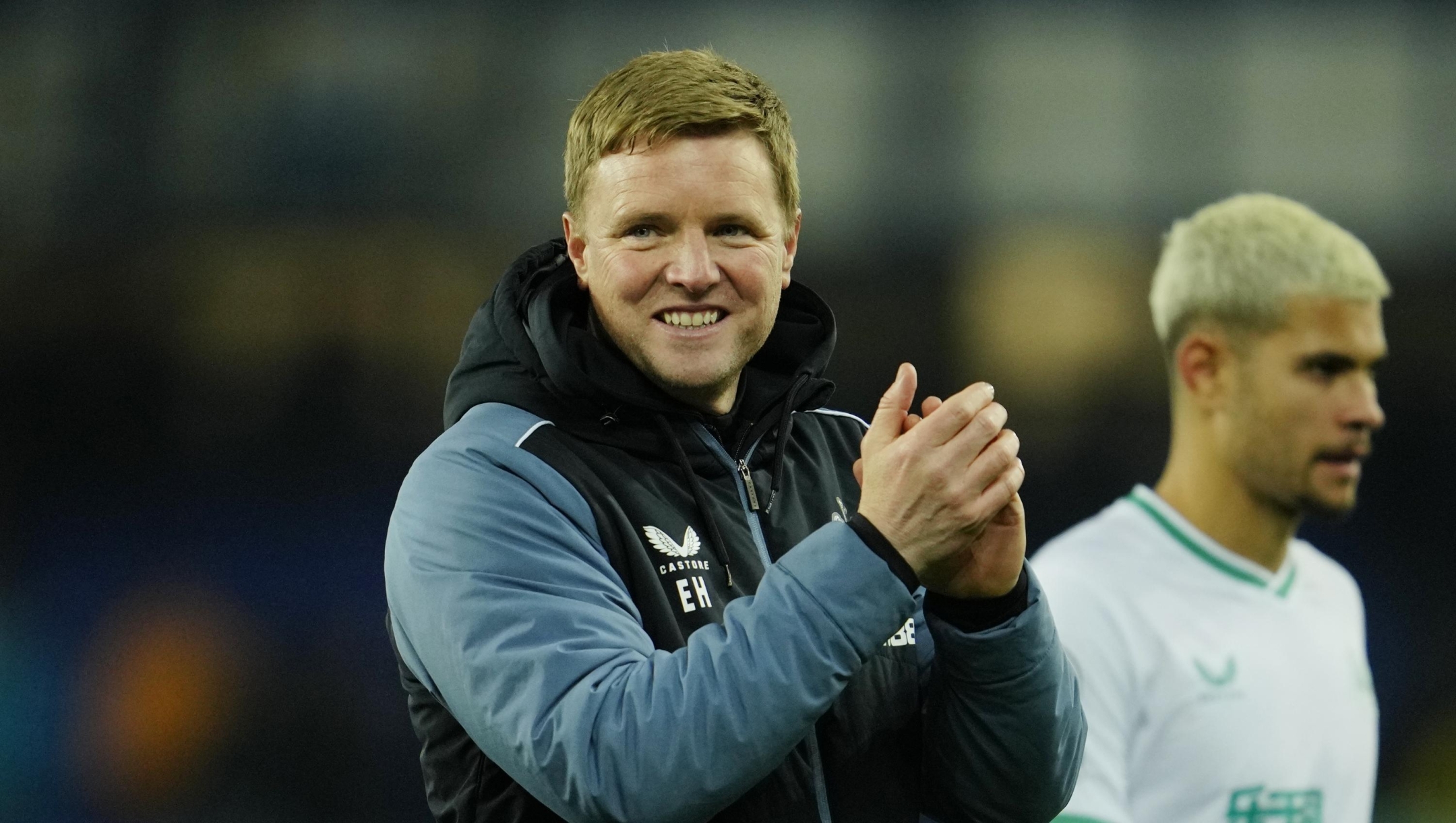 Newcastle's head coach Eddie Howe, centre, celebrates after the English Premier League soccer match between Everton and Newcastle United at the Goodison Park stadium in Liverpool, England, Thursday, April 27, 2023. (AP Photo/Jon Super)