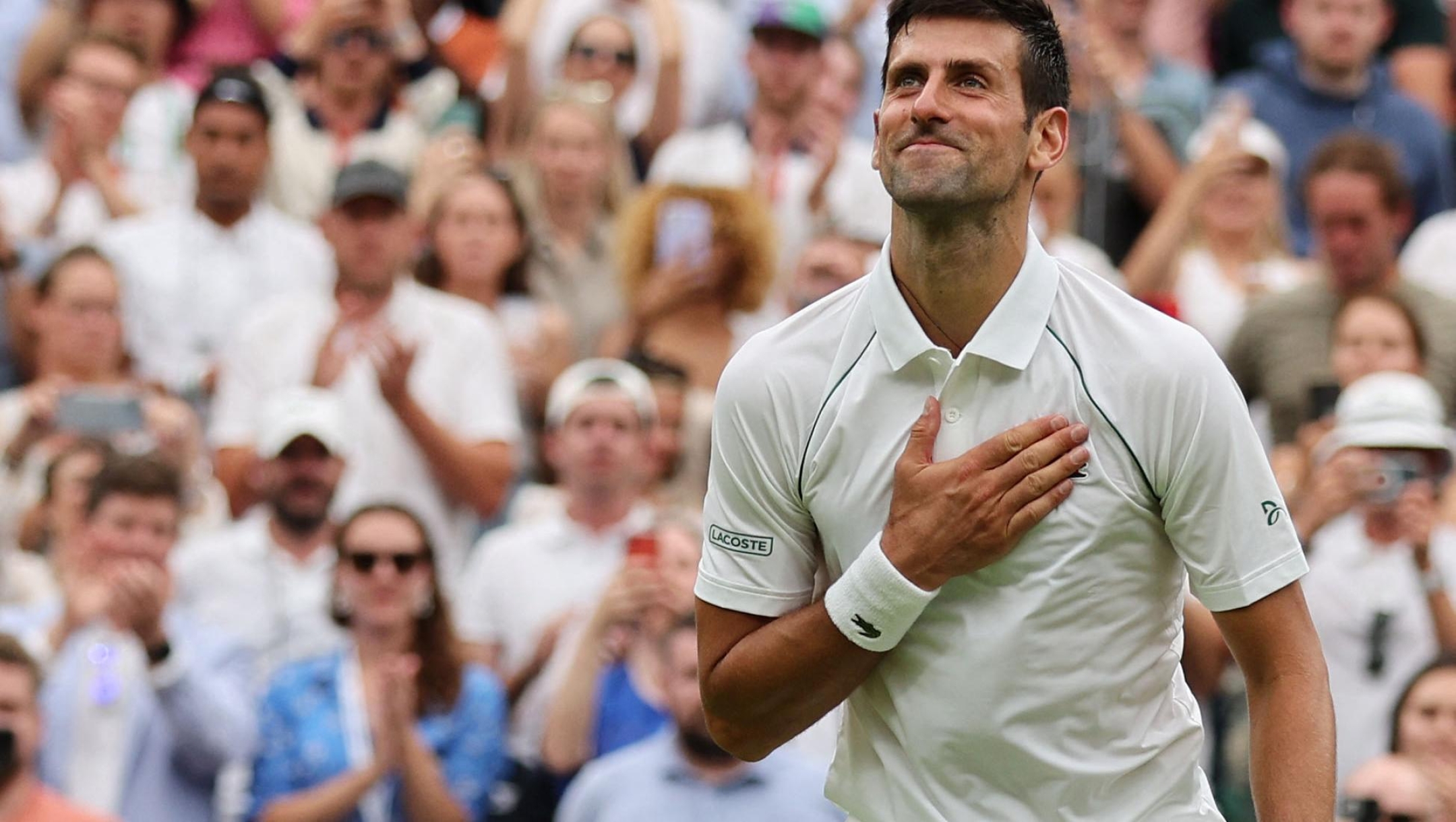 (FILES) Serbia's Novak Djokovic celebrates beating South Korea's Kwon Soon-woo after their men's singles tennis match on the first day of the 2022 Wimbledon Championships at The All England Tennis Club in Wimbledon, southwest London, on June 27, 2022. Novak Djokovic targets an eighth All England Club title and 24th Grand Slam crown at Wimbledon which gets underway on July 3, 2023. Djokovic's 84 wins at Wimbledon are more than the rest of the top 20 combined while nobody else in the top 10 has ever made a semi-final. (Photo by Adrian DENNIS / AFP) / RESTRICTED TO EDITORIAL USE