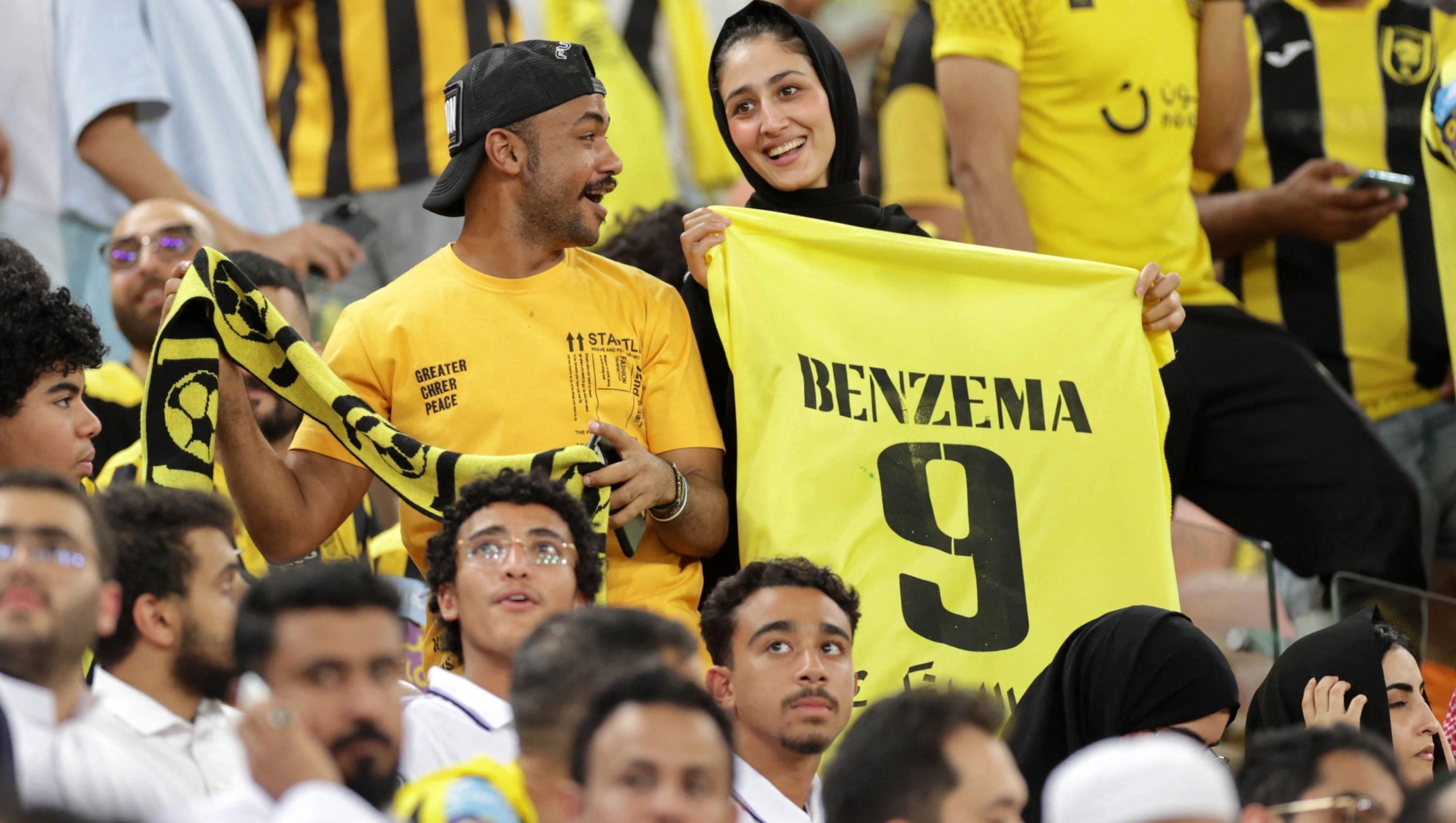 Fans gather at at Al-Ittihad's stadium in Jeddah to welcome Former Real Madrid striker Karim Benzema, on June 8, 2023. Benzema was unveiled as an Al-Ittihad player in front of thousands of fans in Saudi Arabia on June 8, a day after the oil-rich kingdom just failed to reel in Lionel Messi. (Photo by AFP)