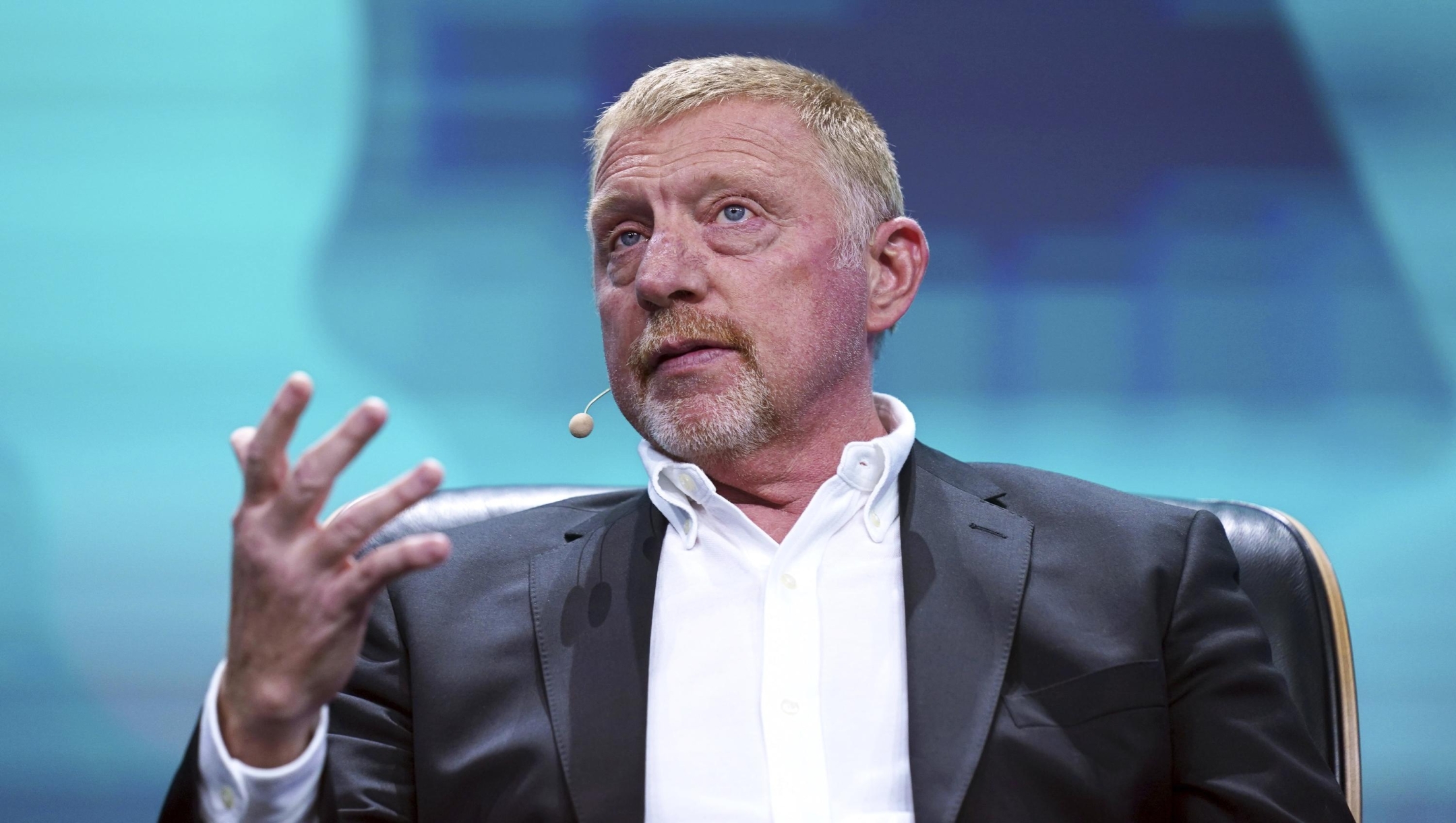 Former tennis player Boris Becker sits on stage at the OMR digital trade show in the exhibition halls, in Hamburg, Germany, Wednesday, May 10, 2023. Around 70,000 visitors are expected at this year's OMR Festival in Hamburg. It is one of the largest marketing and digital conferences in Europe. (Marcus Brandt/dpa via AP)