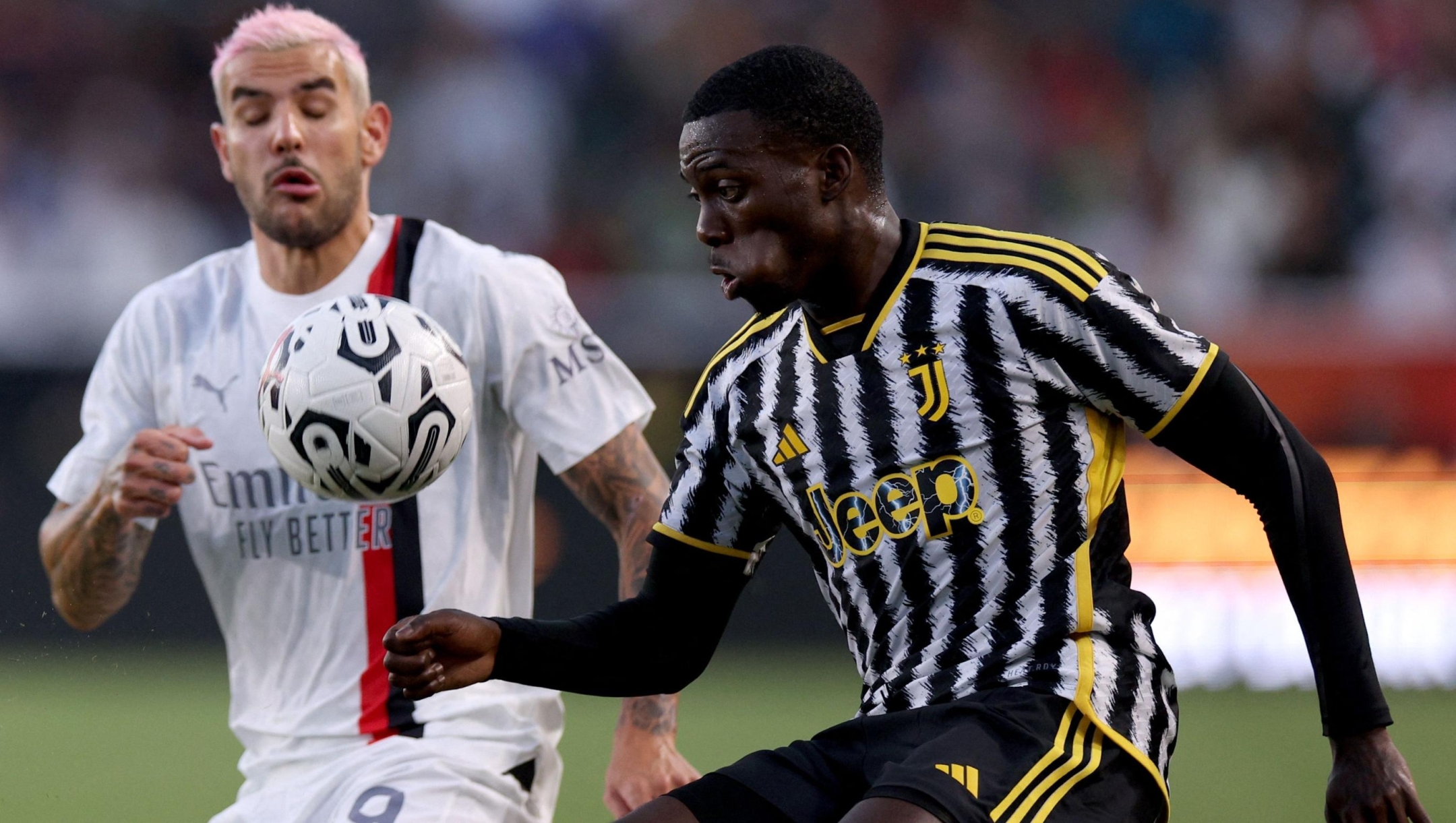 CARSON, CALIFORNIA - JULY 27: Timothy Weah #22 of Juventus plays the ball in front of Theo Hernandez #19 of AC Milan during the Pre-Season Friendly match between Juventus and AC Milan at Dignity Health Sports Park on July 27, 2023 in Carson, California.   Harry How/Getty Images/AFP (Photo by Harry How / GETTY IMAGES NORTH AMERICA / Getty Images via AFP)