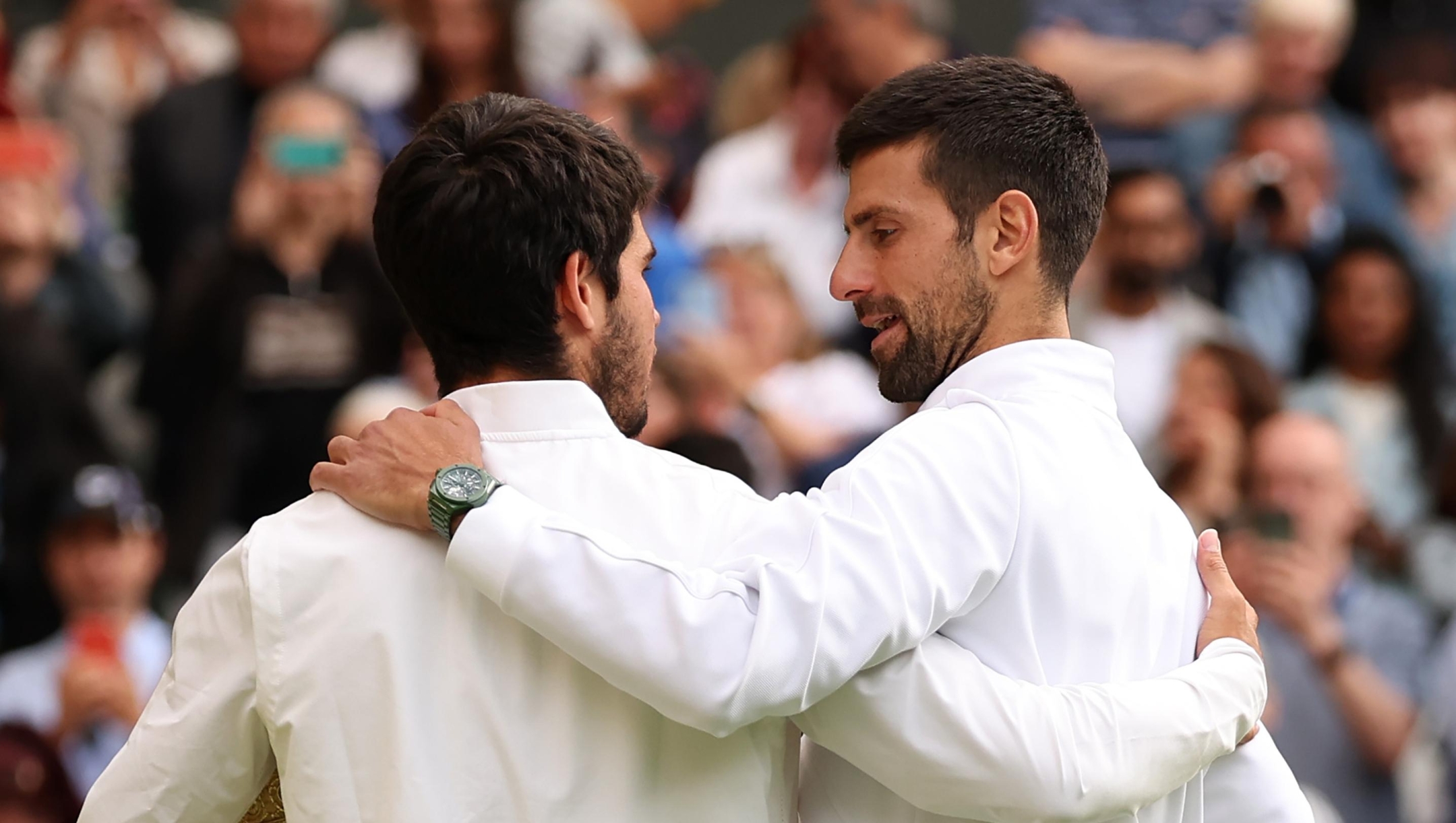 LONDON, ENGLAND - JULY 16: Carlos Alcaraz of Spain is congratulated by Novak Djokovic of Serbia after winning the Men's Singles Final on day fourteen of The Championships Wimbledon 2023 at All England Lawn Tennis and Croquet Club on July 16, 2023 in London, England. (Photo by Julian Finney/Getty Images)
