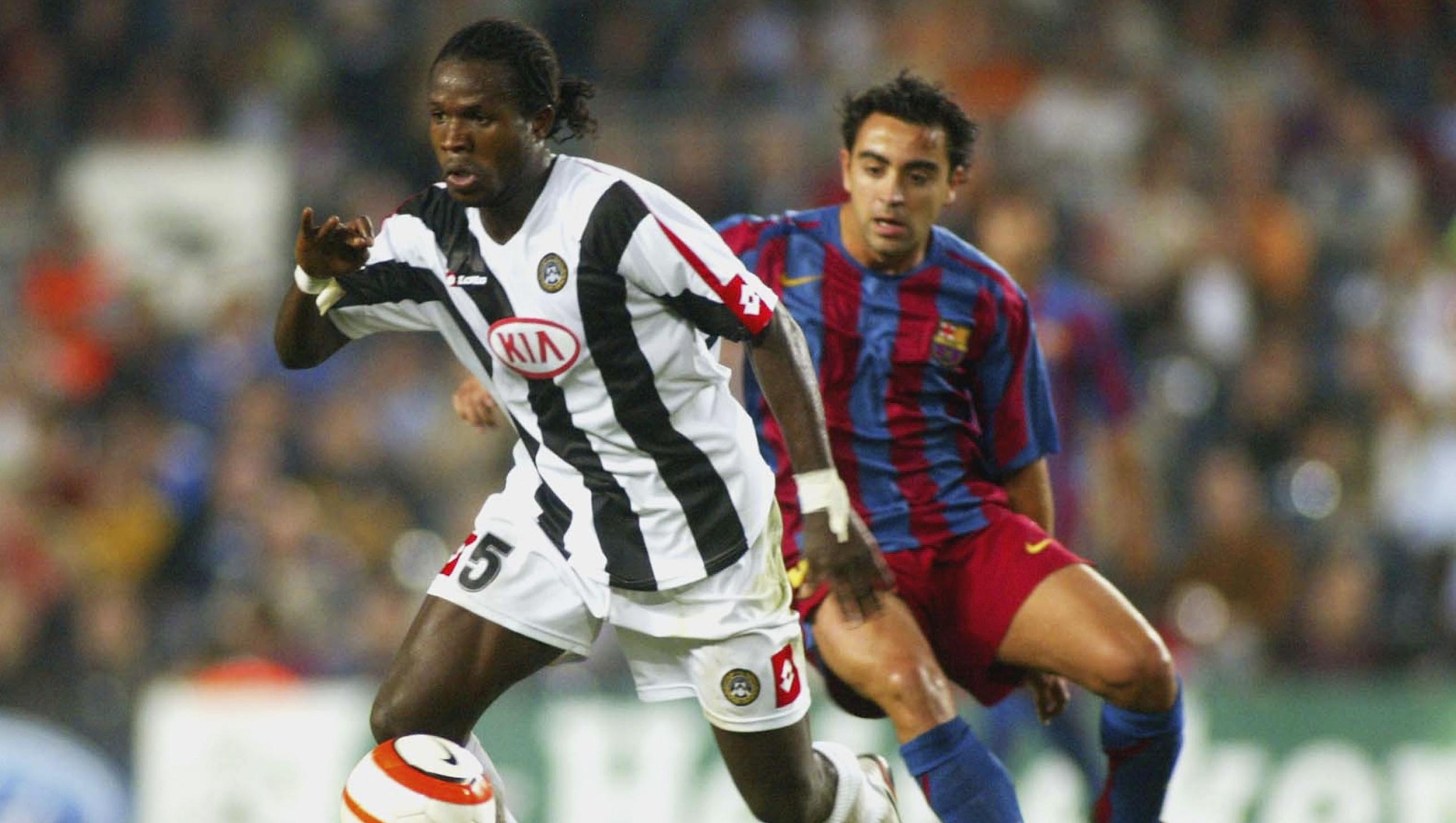 BARCELONA, SPAIN - SEPTEMBER 27:  Christian Obodo of Udinese and Xavi Hernandez of FC Barcelona compete for the ball during the UEFA Champions League Group A match between FC Barcelona and Udinese played at the Camp Nou stadium on September 27, 2005 in Barcelona, Spain. (Photo by Luis Bagu/Getty Images) *** Local Caption *** Christian Obodo;Xavi Hernandez