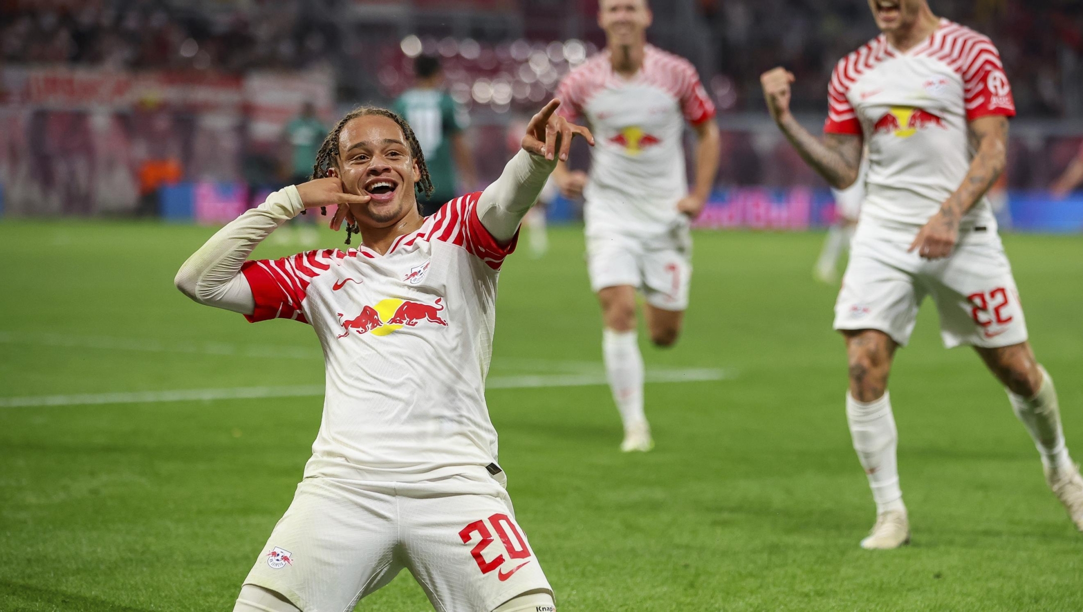 Leipzig player Xavi Simons celebrates scoring his side's fifth goal of the game during the German Bundesliga soccer match between RB Leipzig and VfB Stuttgart at the Red Bull Arena in Leipzig, Germany, Friday, Aug. 25, 2023. (Jan Woitas/dpa via AP)