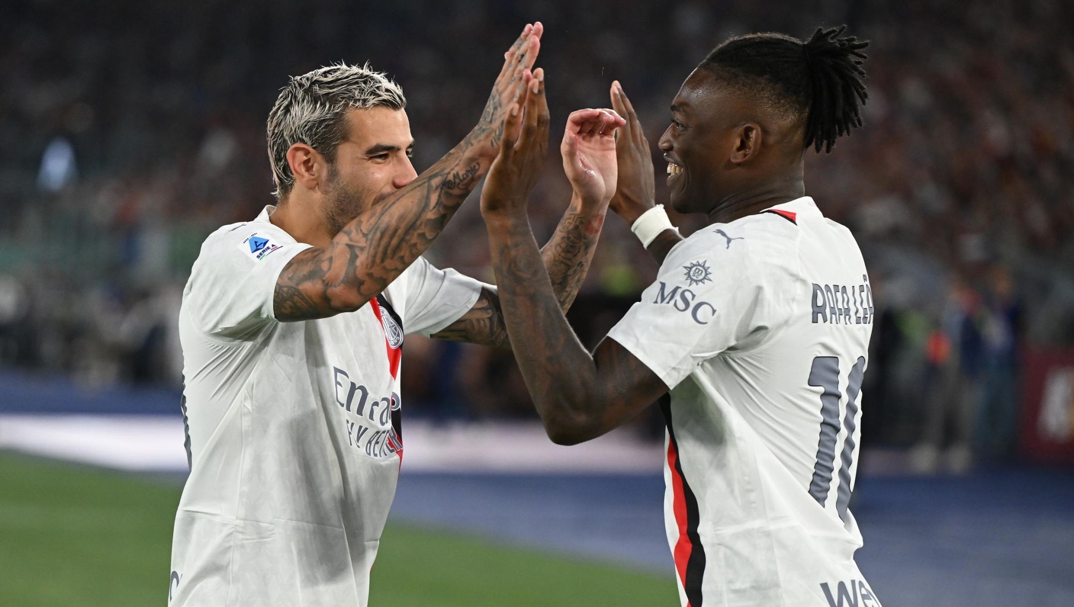 ROME, ITALY - SEPTEMBER 01:  Rafael Leao of AC Milan celebrates with Theo Hernandez after scoring the goal during the Serie A TIM match between AS Roma and AC Milan at Stadio Olimpico on September 01, 2023 in Rome, Italy. (Photo by Claudio Villa/AC Milan via Getty Images)