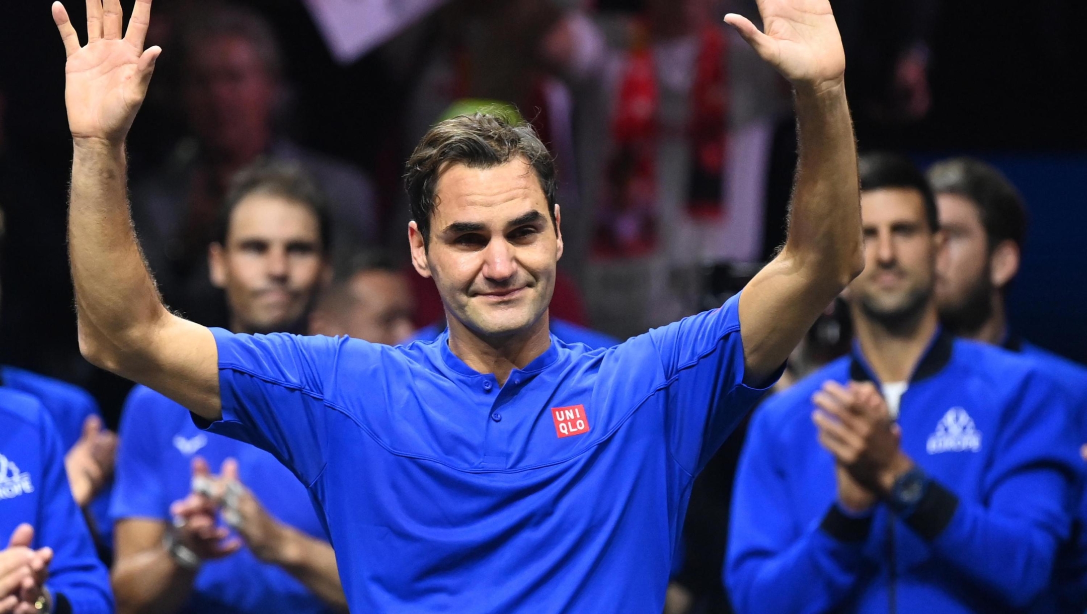 epa10202794 Team Europe player Roger Federer of Switzerland waves to the crowd after playing the doubles match with Rafael Nadal (rear L) of Spain against Team World double Jack Sock of the US and Frances Tiafoe of the US on the first day of the Laver Cup tennis tournament in London, Britain, 23 September 2022. The match was Federer's last game before retirement.  EPA/ANDY RAIN
