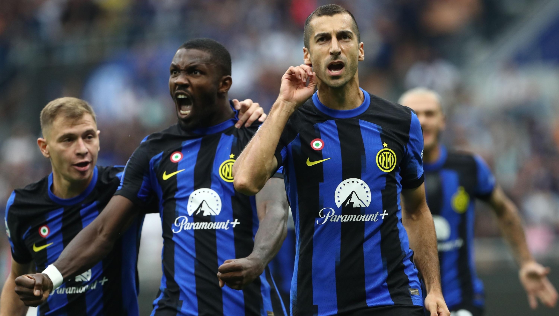 MILAN, ITALY - SEPTEMBER 16: Henrikh Mkhitaryan of FC Internazionale celebrates with his team-mate Marcus Thuram after scoring the opening goal during the Serie A TIM match between FC Internazionale and AC Milan at Stadio Giuseppe Meazza on September 16, 2023 in Milan, Italy. (Photo by Marco Luzzani/Getty Images)