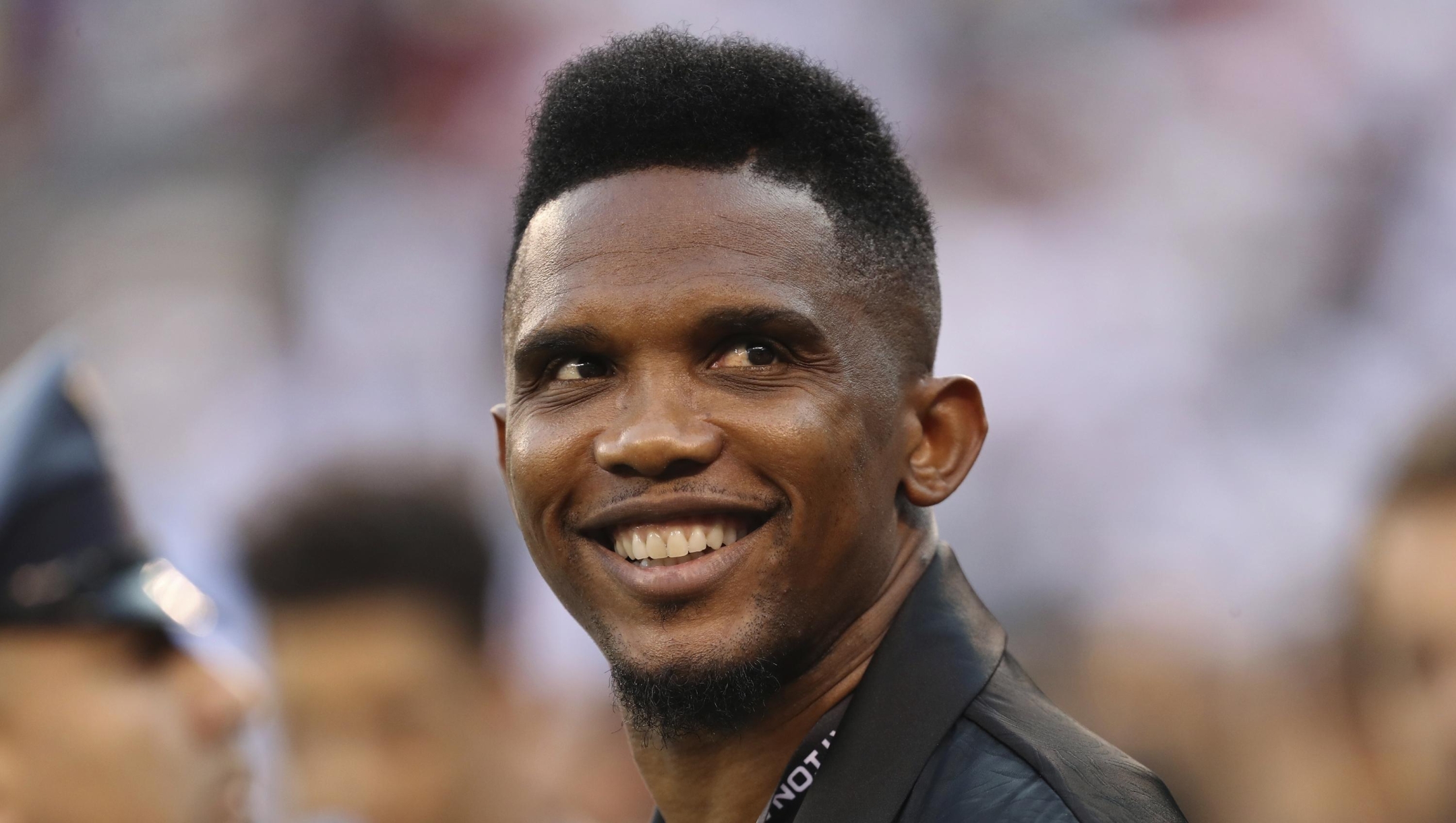 FILE - Soccer player Samuel Eto'o watches warmups before an International Champions Cup soccer match between Atletico Madrid and Real Madrid, July 26, 2019, in East Rutherford, N.J. Eto?o, president of the Cameroon soccer federation, is being investigated by the Confederation of African Football for alleged ?improper conduct." The former Barcelona and Inter Milan forward was elected to a four-year term in December 2021 but the initial euphoria that greeted his reforms is giving way to accusations of clientelism and unfulfilled financial promises to clubs. (AP Photo/Steve Luciano, File)