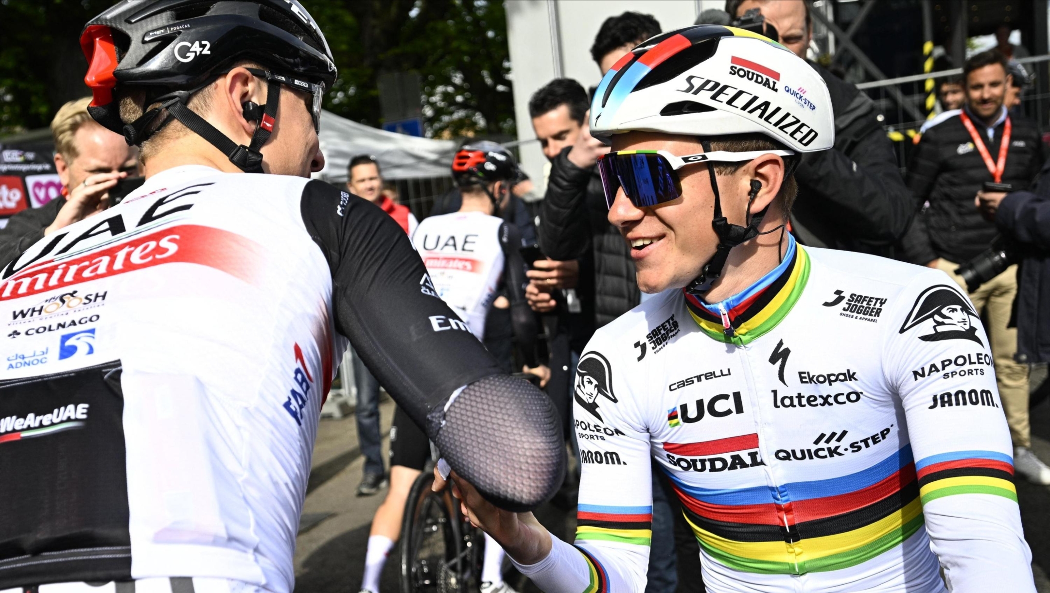 UAE Team Emirates' Slovenian rider Tadej Pogacar (L) shakes hands with Soudal Quick-Step's Belgian rider Remco Evenepoel prior to the start of the men elite race of the Liege-Bastogne-Liege one day cycling event, 258,5 km from Liege to Liege, on April 23, 2023. (Photo by JASPER JACOBS / Belga / AFP) / Belgium OUT