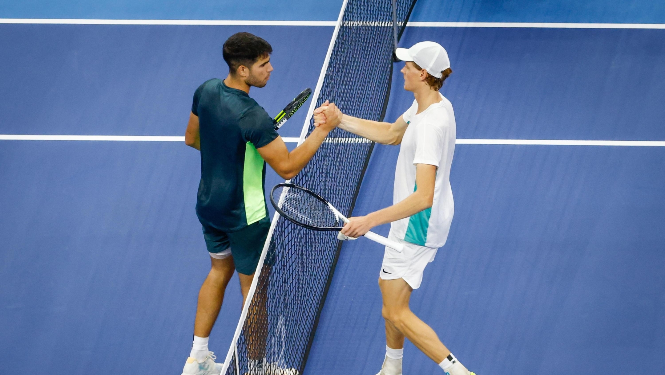 epa10897487 Carlos Alcaraz (L) of Spain shakes hands with Jannik Sinner (R) of Italy after losing his semi-final match in the China Open tennis tournament in Beijing, China, 03 October 2023.  EPA/MARK R. CRISTINO