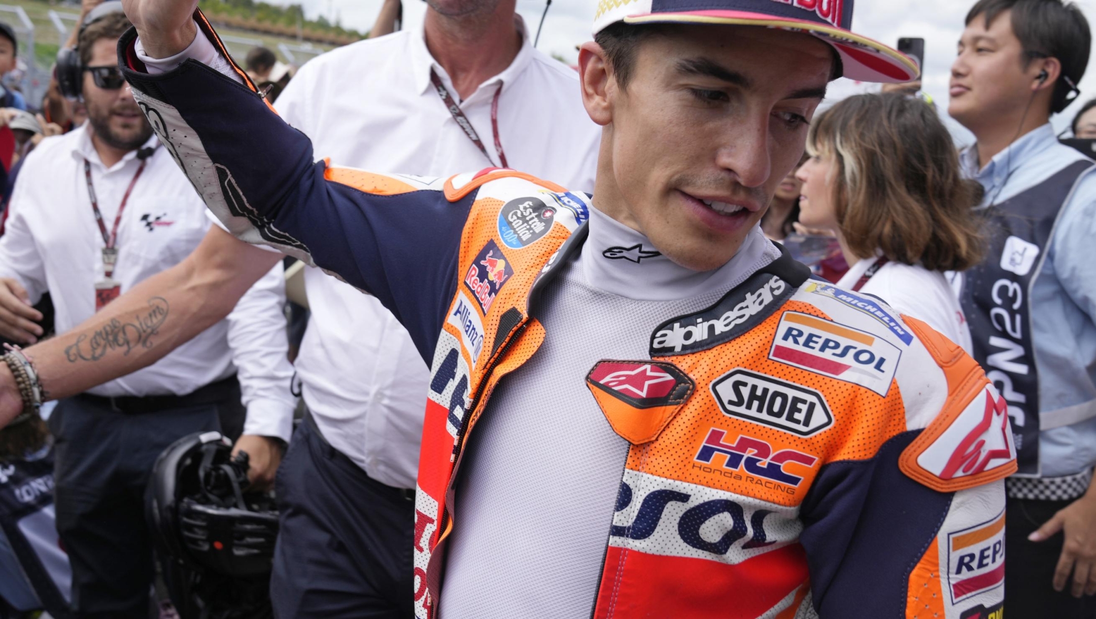 Spanish rider Marc Marquez waves to fans after the MotoGP qualification session for Sunday's Japanese Motorcycle Grand Prix at the Twin Ring Motegi circuit in Motegi, north of Tokyo Saturday Sept. 30, 2023. Honda’s MotoGP team says that former world champion Marc Márquez will be leaving the team at the end of the season. That will conclude a highly successful 11-year-stint during which the Spaniards won six MotoGP championships. (AP Photo/Shuji Kajiyama)