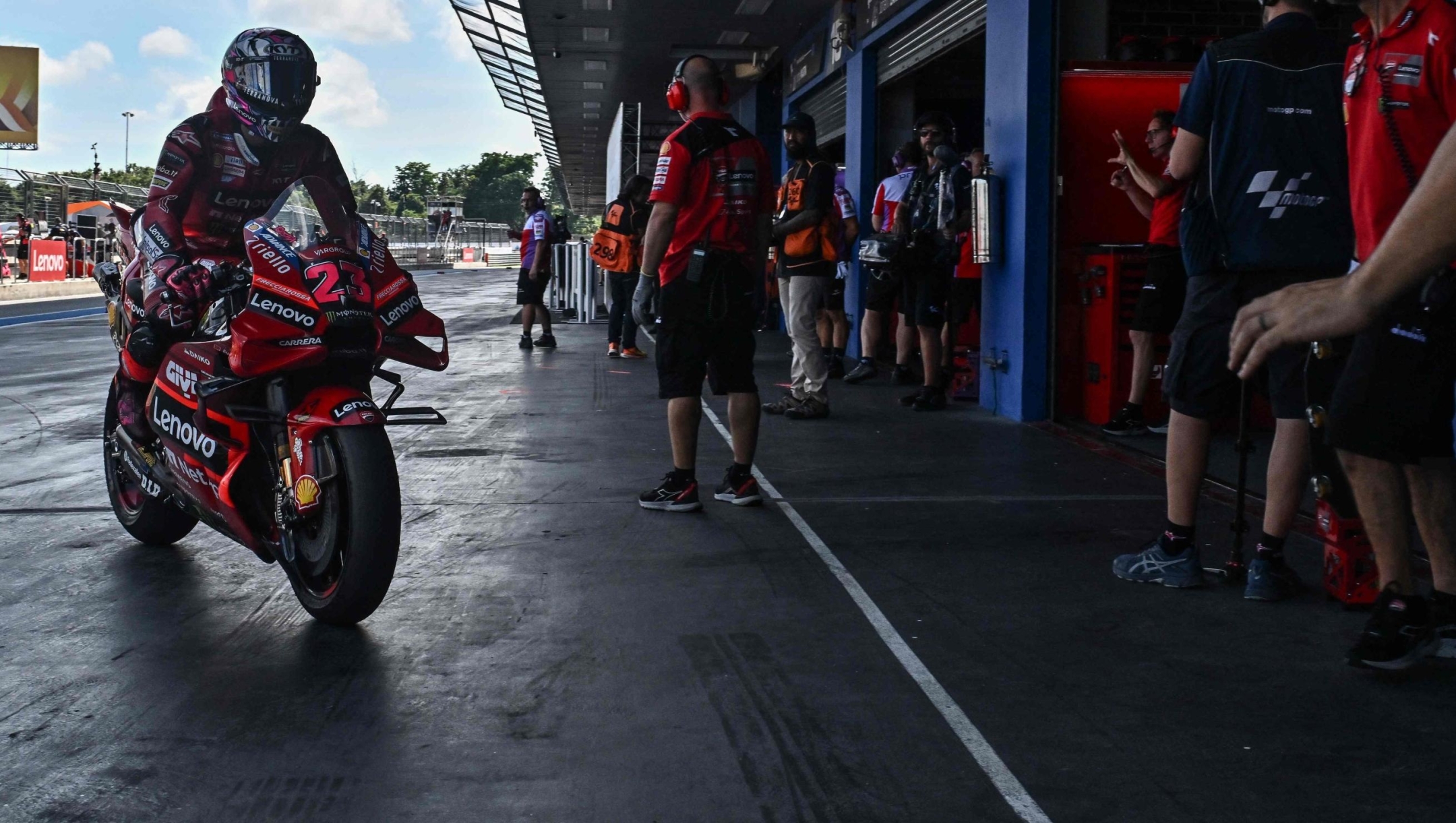 Ducati Lenovo Team's Italian rider Enea Bastianini rides in the pit lane during the second practice session of the MotoGP Thailand Grand Prix at the Buriram International Circuit in Buriram on October 28, 2023. (Photo by Lillian SUWANRUMPHA / AFP)