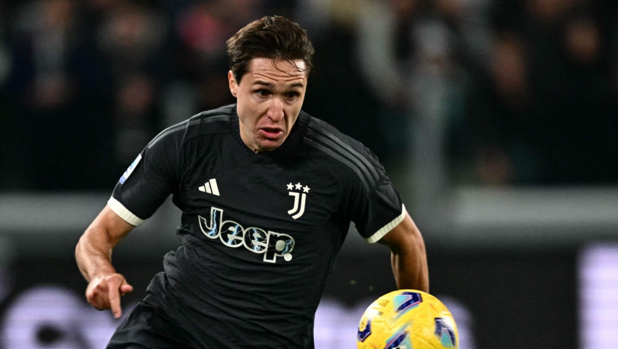 Juventus' Italian forward #07 Federico Chiesa eyes the ball during the Italian Serie A football match between Juventus and Cagliari, at The Allianz Stadium, in Turin on November 11, 2023. (Photo by GABRIEL BOUYS / AFP)