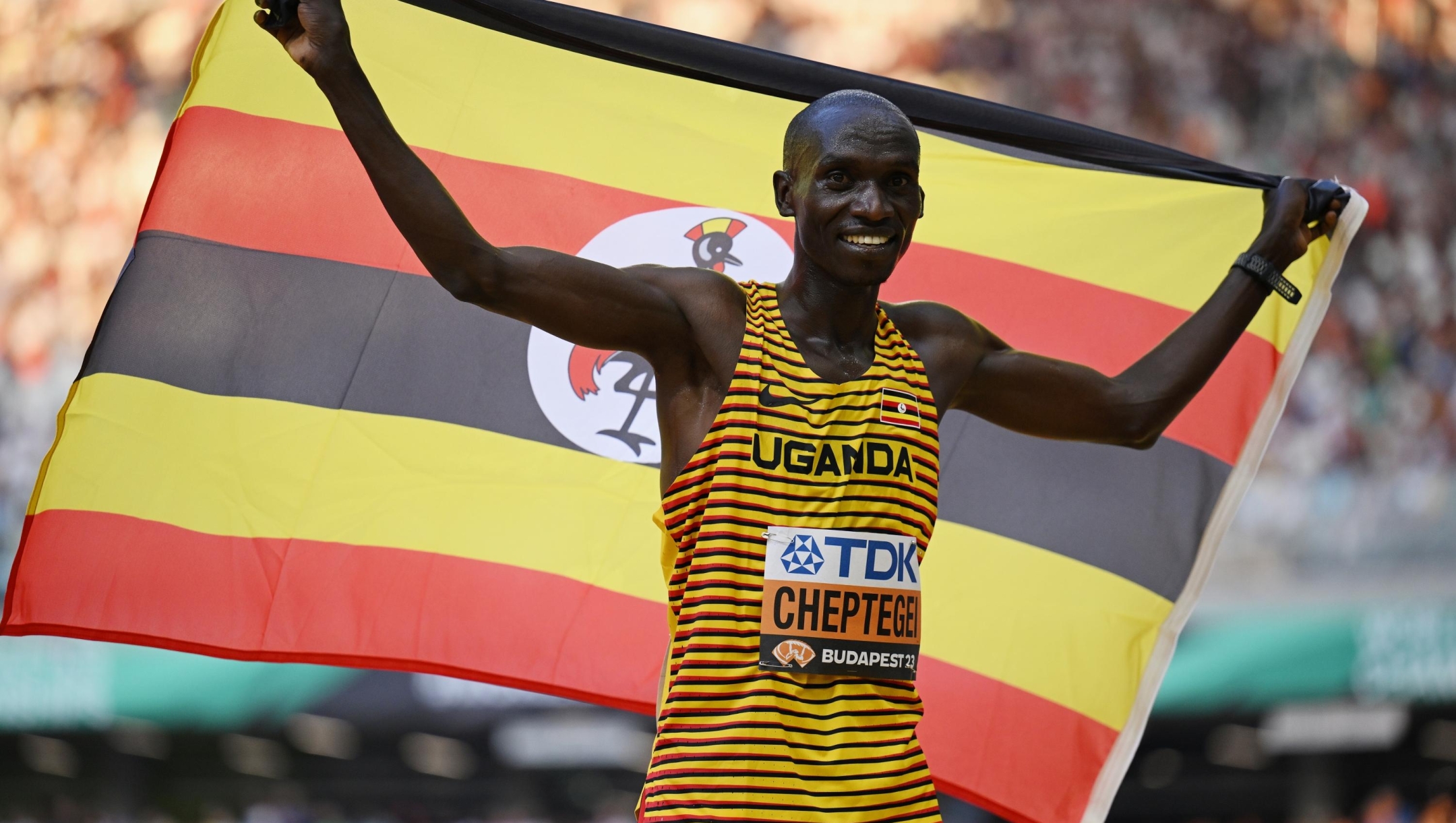 BUDAPEST, HUNGARY - AUGUST 20: Joshua Cheptegei of Team Uganda reacts after winning gold in the Men's 10,000m Final during day two of the World Athletics Championships Budapest 2023 at National Athletics Centre on August 20, 2023 in Budapest, Hungary. (Photo by Shaun Botterill/Getty Images)