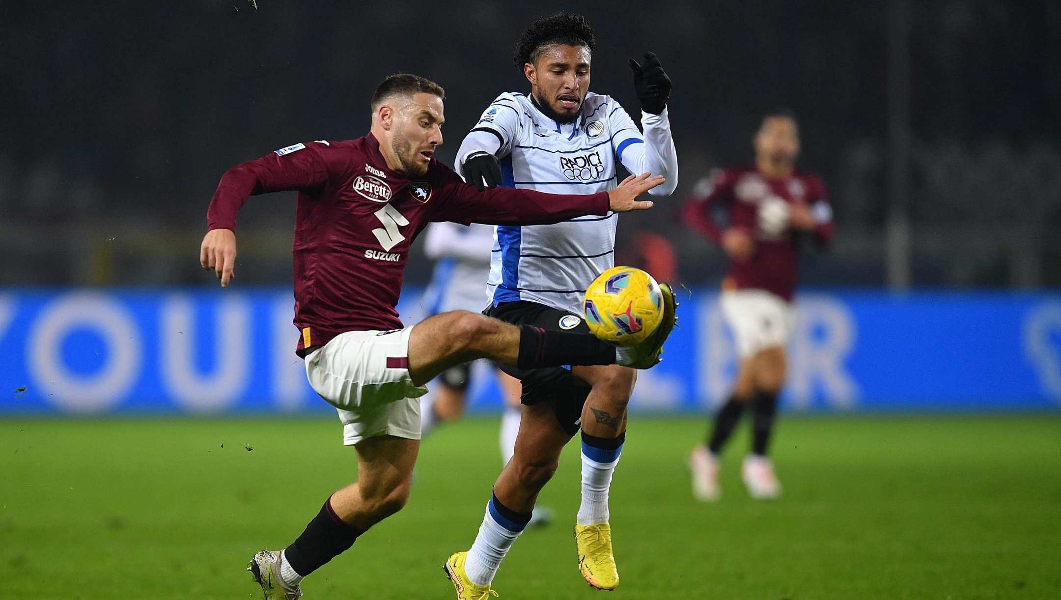 TURIN, ITALY - DECEMBER 04:  Nikola Vlasic of Torino FC is clashes with Dos Santos Ederson of Atalanta BC during the Serie A TIM match between Torino FC and Atalanta BC at Stadio Olimpico di Torino on December 4, 2023 in Turin, Italy.  (Photo by Valerio Pennicino/Getty Images)