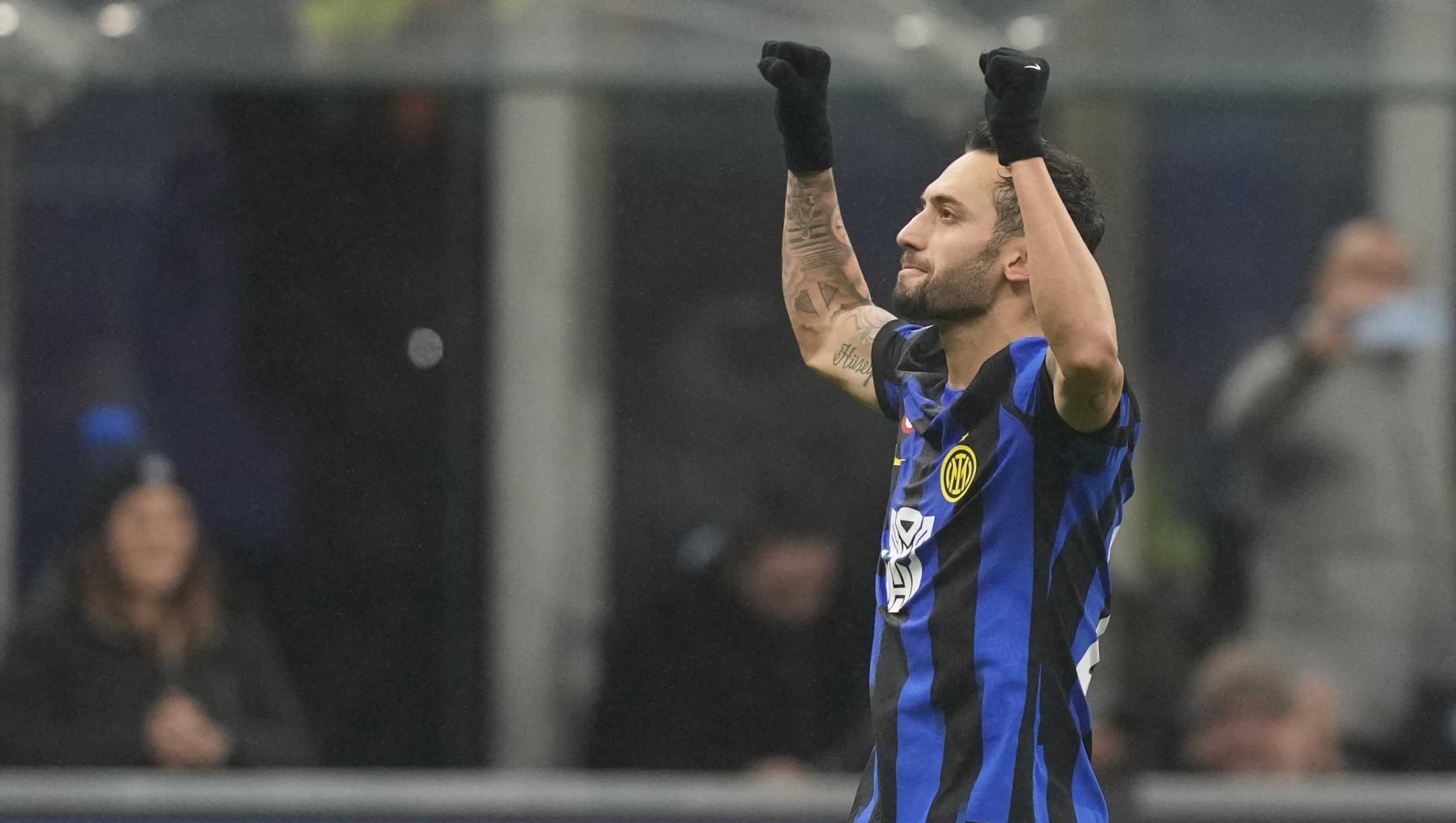 Inter Milan's Hakan Calhanoglu celebrates after scoring the opening goal during the Serie A soccer match between Inter Milan and Udinese at the San Siro Stadium in Milan, Italy, Saturday, Dec. 9, 2023. (AP Photo/Antonio Calanni)