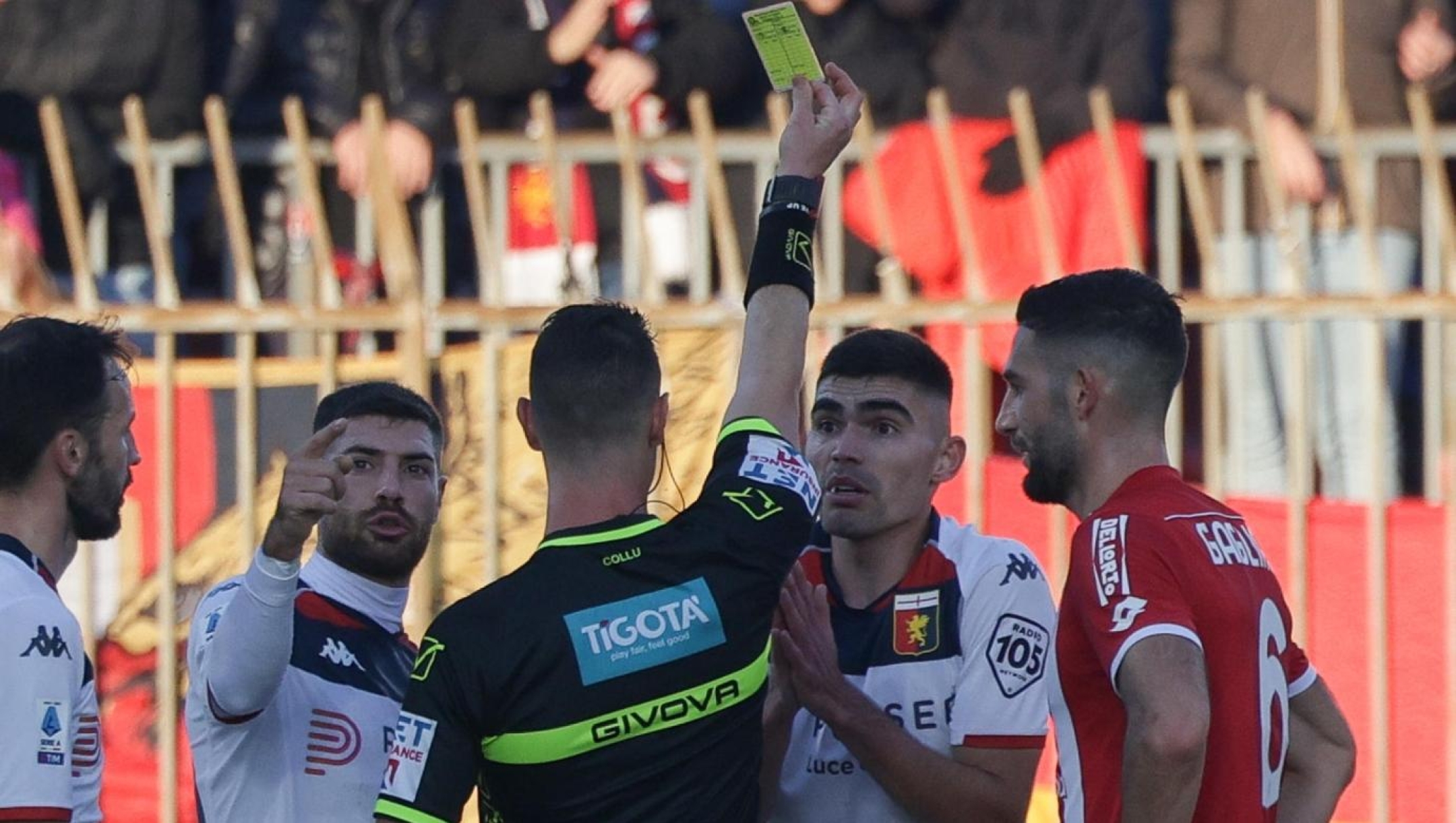 Referee Giuseppe Collu shows the yellow card to Genoa CFC's defender Johan Vasquez during the Italian Serie A soccer match between AC Monza and CFC Genoa at U-Power Stadium in Monza, Italy, 10 December 2023. ANSA / ROBERTO BREGANI
