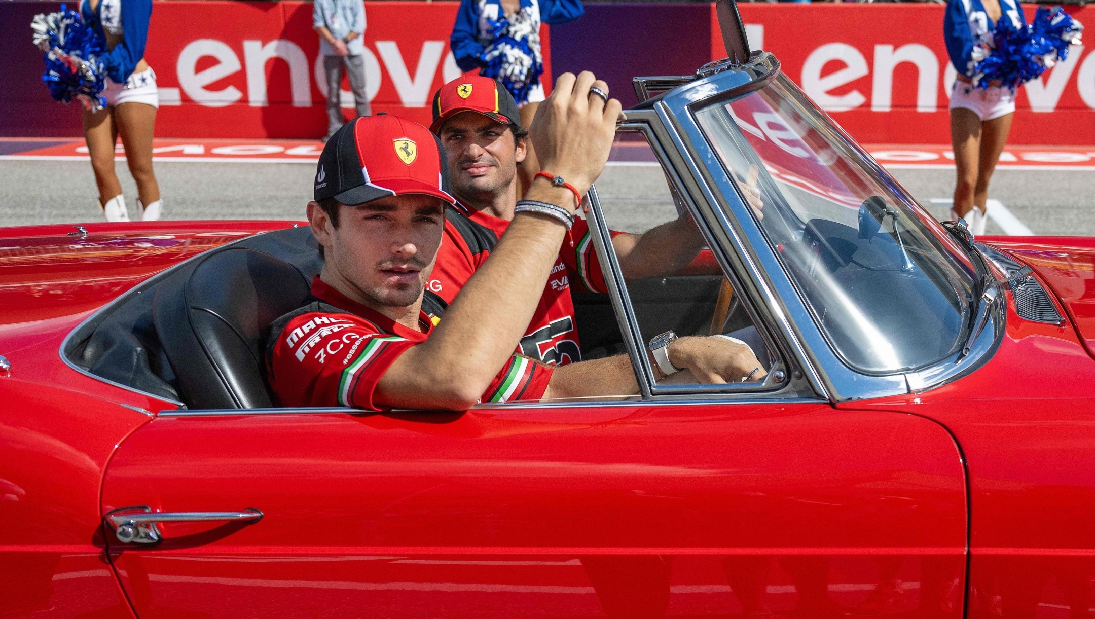 Ferrari's Monegasque driver Charles Leclerc and Ferrari's Spanish driver Carlos Sainz Jr., take part in the drivers' parade ahead the 2023 United States Formula One Grand Prix at the Circuit of the Americas in Austin, Texas, on October 22, 2023. (Photo by Jim WATSON / AFP)