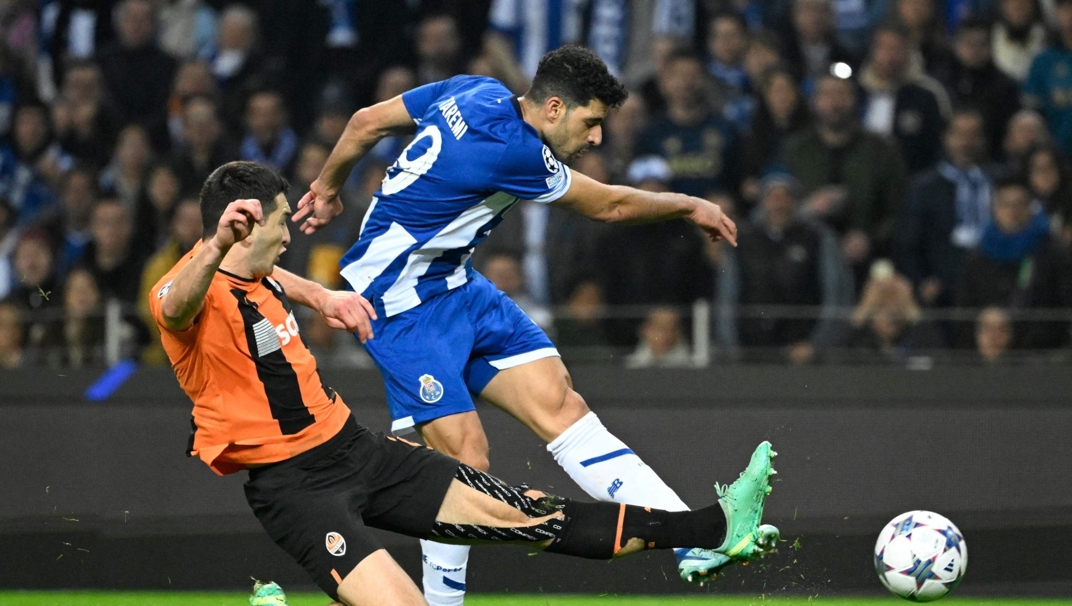 FC Porto's Iranian forward #09 Mehdi Taremi scores his team's third goal during the UEFA Champions League Group H football match between FC Porto and FC Shakhtar Donetsk at the Dragao stadium in Porto on December 13, 2023. (Photo by MIGUEL RIOPA / AFP)