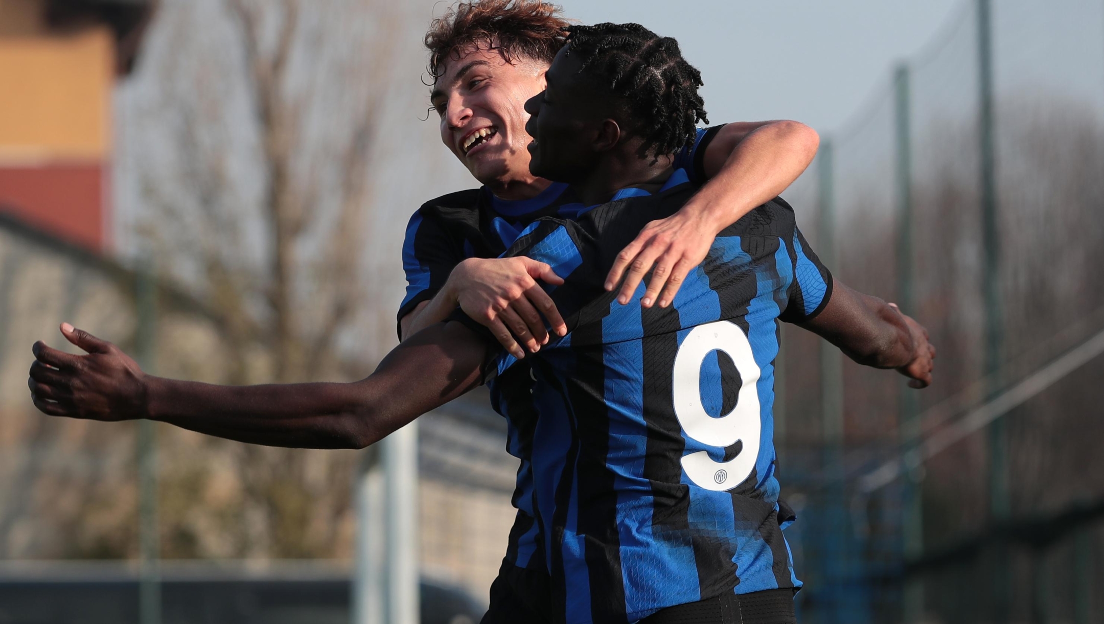 MILAN, ITALY - DECEMBER 12: Amadou Sarr of FC Internazionale celebrates with Luca Di Maggio after scoring the team's first goal during the UEFA Youth League match between FC Internazionale U19 and Real Sociedad at Konami Youth Development Center on December 12, 2023 in Milan, Italy. (Photo by Emilio Andreoli - Inter/Inter via Getty Images)