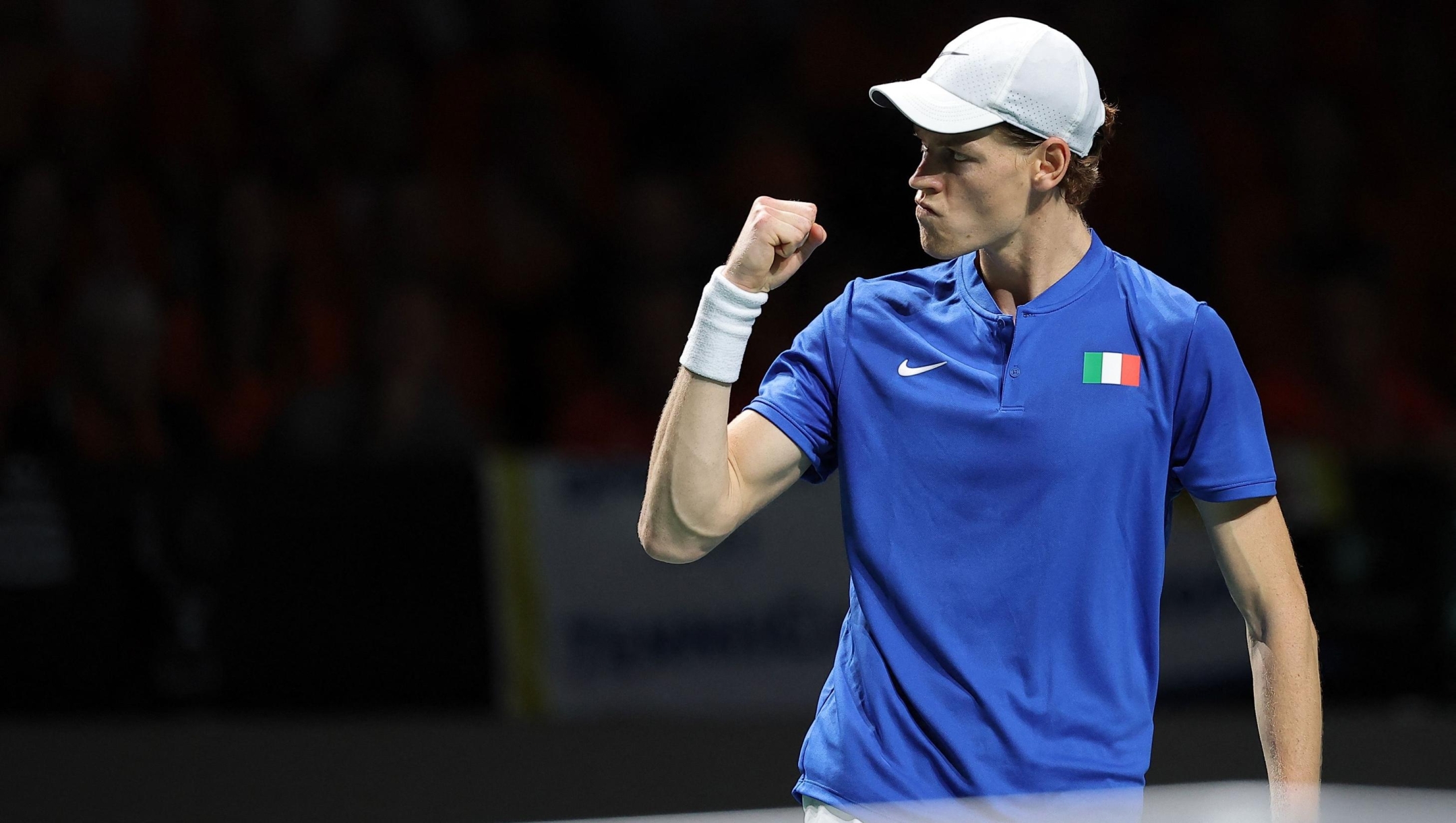 Italy's Jannik Sinner reacts as he plays against Netherlands' Tallon Griekspoor during the second men's single quarter-final tennis match between Italy and Netherlands of the Davis Cup tennis tournament at the Martin Carpena sportshall, in Malaga on November 23, 2023. (Photo by LLUIS GENE / AFP)