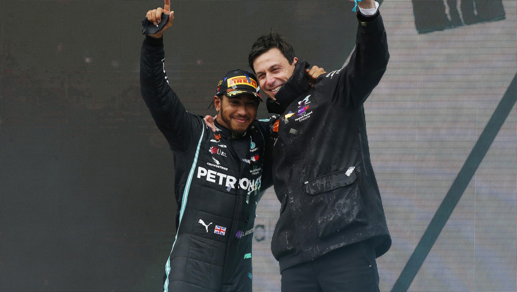 ISTANBUL, TURKEY - NOVEMBER 15: Race winner Lewis Hamilton of Great Britain and Mercedes GP celebrates winning a 7th F1 World Drivers Championship with Mercedes GP Executive Director Toto Wolff on the podium during the F1 Grand Prix of Turkey at Intercity Istanbul Park on November 15, 2020 in Istanbul, Turkey. (Photo by Kenan Asyali - Pool/Getty Images)