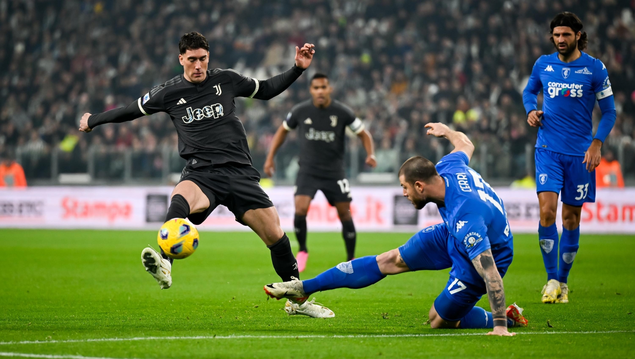 TURIN, ITALY - JANUARY 27: Dusan Vlahovic of Juventus is challenged by Alberto Cerri of Empoli during the Serie A TIM match between Juventus and Empoli FC at Allianz Stadium on January 27, 2024 in Turin, Italy. (Photo by Daniele Badolato - Juventus FC/Juventus FC via Getty Images)