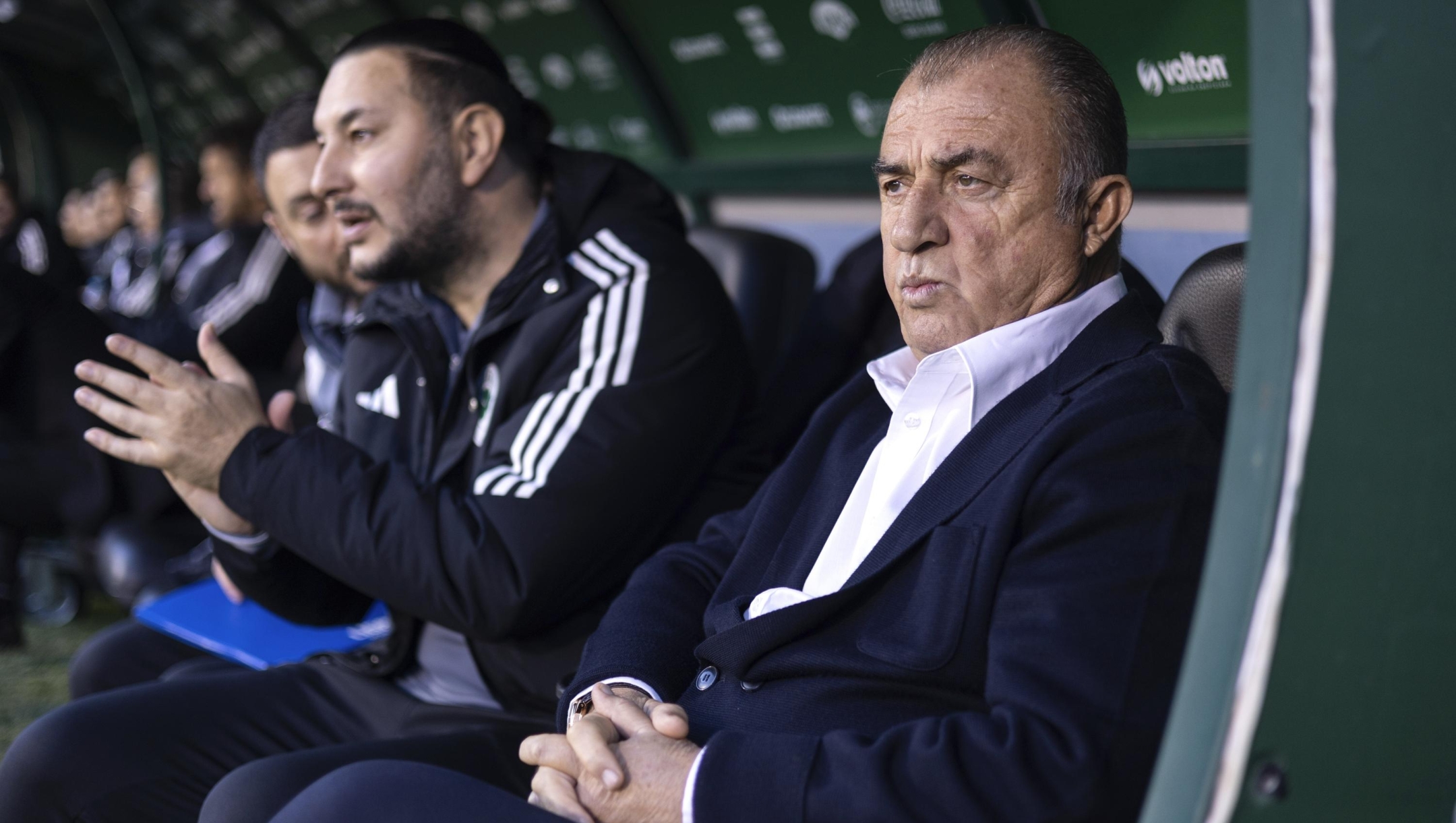 Panathinaikos' head coach Fatih Terim, right, waits for a Greek Super League soccer match against Panetolikos to start, in Athens, Greece, Sunday, Jan. 7, 2024. (AP Photo/Yorgos Karahalis)