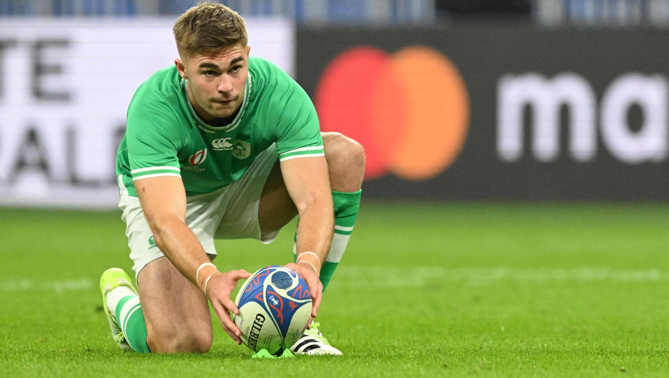 (FILES) Ireland's fly-half Jack Crowley gets ready to kick a penalty during the France 2023 Rugby World Cup Pool B match between South Africa and Ireland at the Stade de France in Saint-Denis, on the outskirts of Paris on September 23, 2023. With Nash, Crowley and MacCarthy, Ireland's team holds a diagonal with not much international experience, before the clash against France on February 2, 2024, in the opening match of the Six Nations tournament. (Photo by MARTIN BUREAU / AFP)