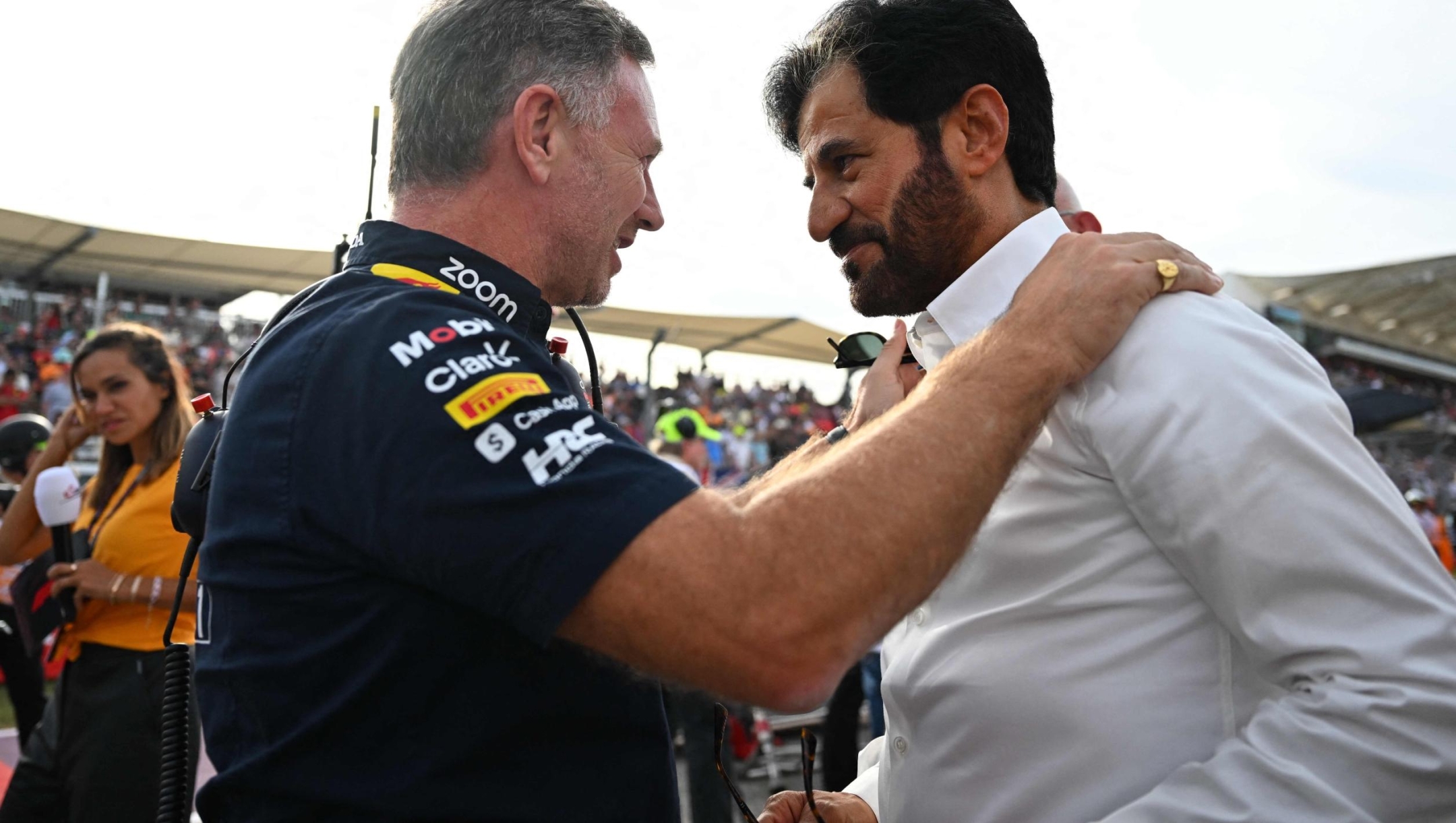 Red Bull Racing's British team principal Christian Horner (L) speaks with FIA President Mohammed Ben Sulayem before the Sprint at the Circuit of the Americas in Austin, Texas, on October 21, 2023, ahead of the United States Formula One Grand Prix. (Photo by Chandan Khanna / AFP)
