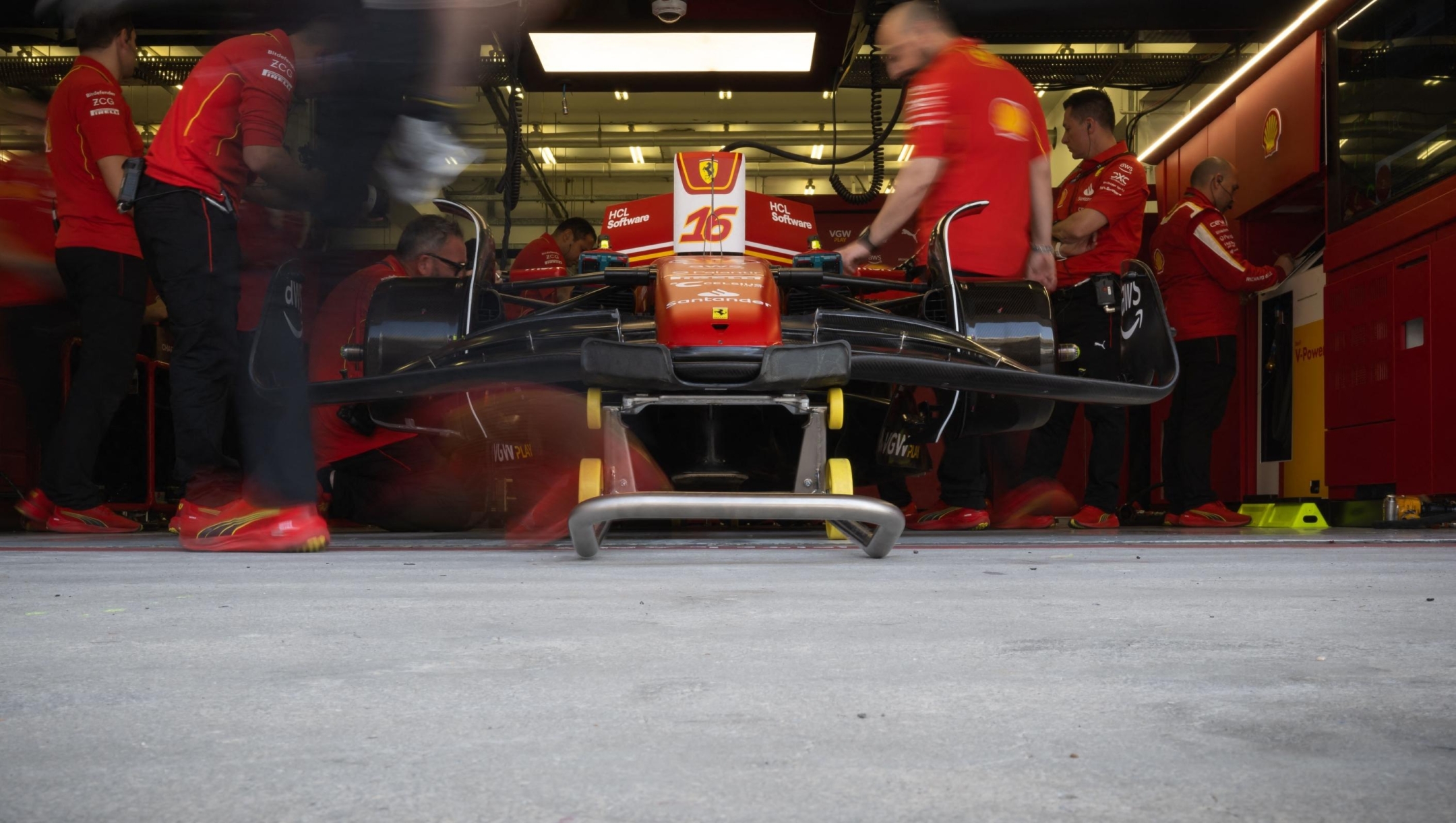 Race engineers prepare the car of Ferrari's Monegasque driver Charles Leclerc during the second day of the Formula One pre-season testing at the Bahrain International Circuit in Sakhir on February 22, 2024. (Photo by Andrej ISAKOVIC / AFP)