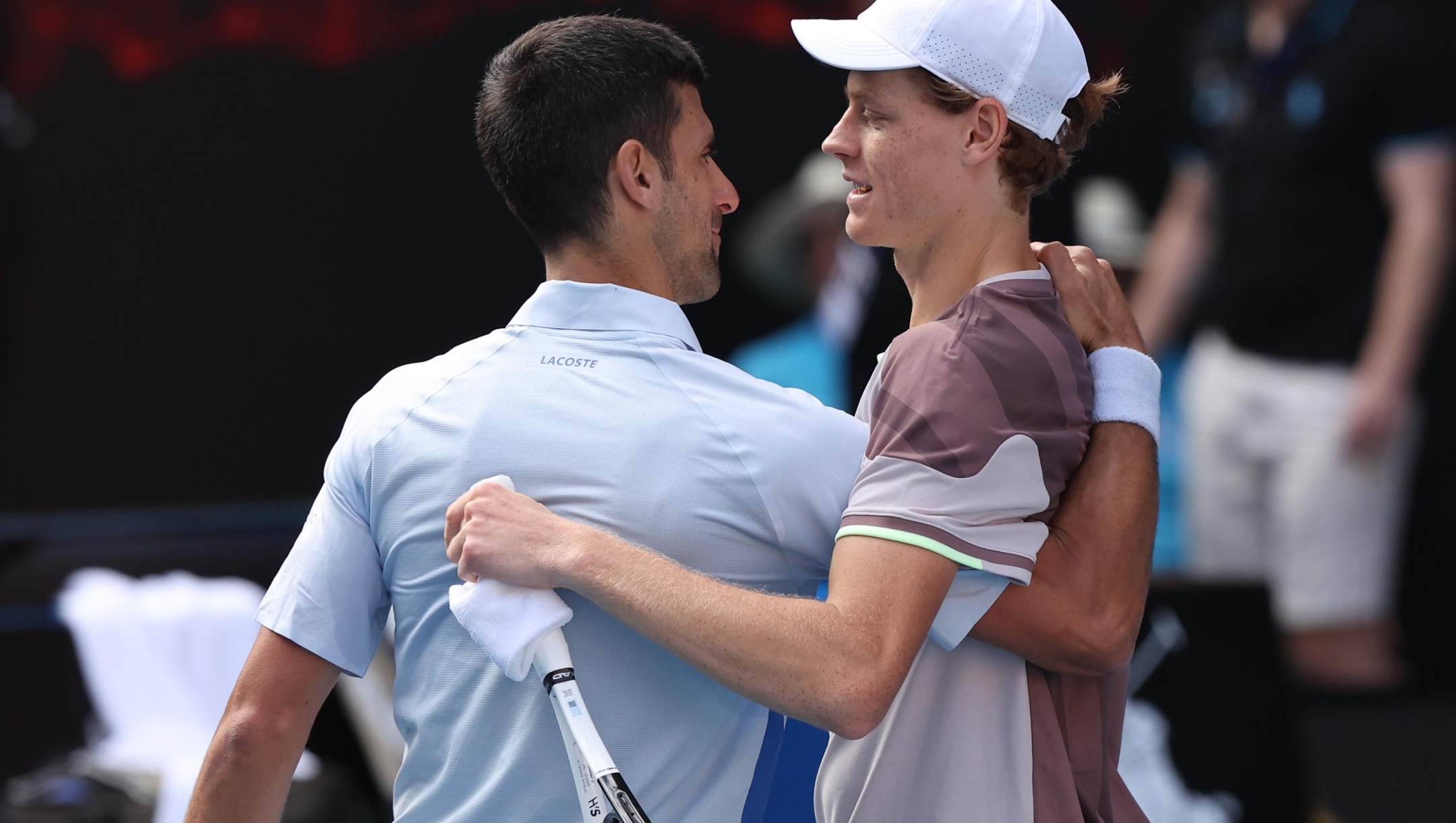 MELBOURNE, AUSTRALIA - JANUARY 26: Jannik Sinner of Italy shakes hands with Novak Djokovic of Serbia in their Semifinal singles match during the 2024 Australian Open at Melbourne Park on January 26, 2024 in Melbourne, Australia. (Photo by Darrian Traynor/Getty Images)