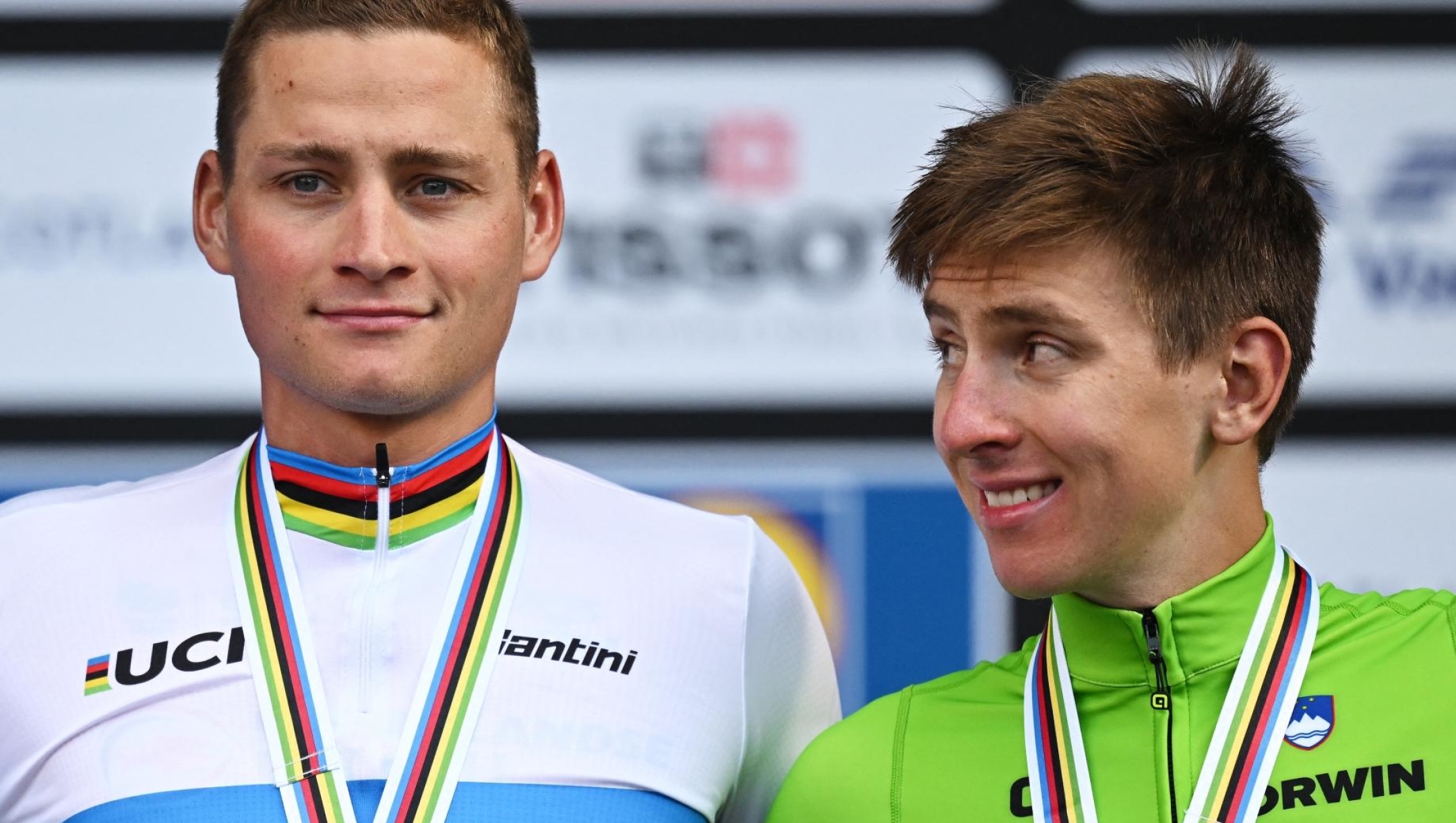 Netherland's Mathieu van der Poel (C), Belgium's Wout van Aert (L) and Slovenia's Tadej Pogacar stand on the podium after the men's Elite Road Race at the Cycling World Championships in Edinburgh, Scotland on August 6, 2023. men's Elite Road Race at the Cycling World Championships in Edinburgh, Scotland on August 6, 2023. Netherland's Mathieu van der Poel took first place in the race that began in Scotland's capital city, Edinburgh, and ended with a street circuit in Glasgow. Belgium's Wout van Aert came second with Slovenia's Tadej Pogacar finishing in third place. (Photo by Oli SCARFF / AFP)