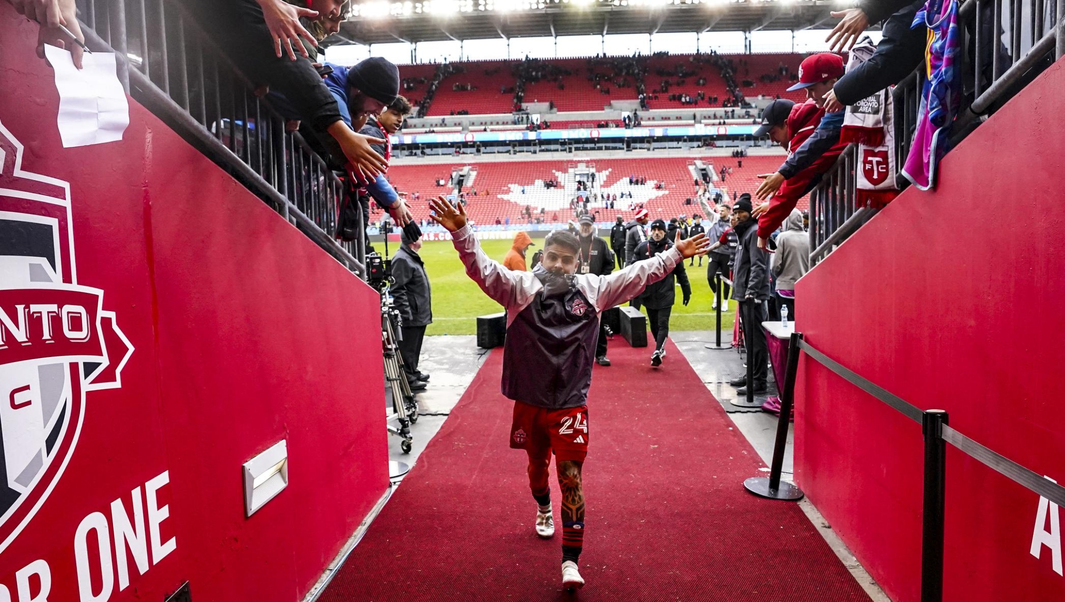 Toronto FC's Lorenzo Insigne greets fans as he returns to the locker room after scoring the game winning goal in his team's 1-0 win over Charlotte FC in an MLS soccer game in Toronto, Saturday, March 9, 2024. (Chris Young/The Canadian Press via AP)