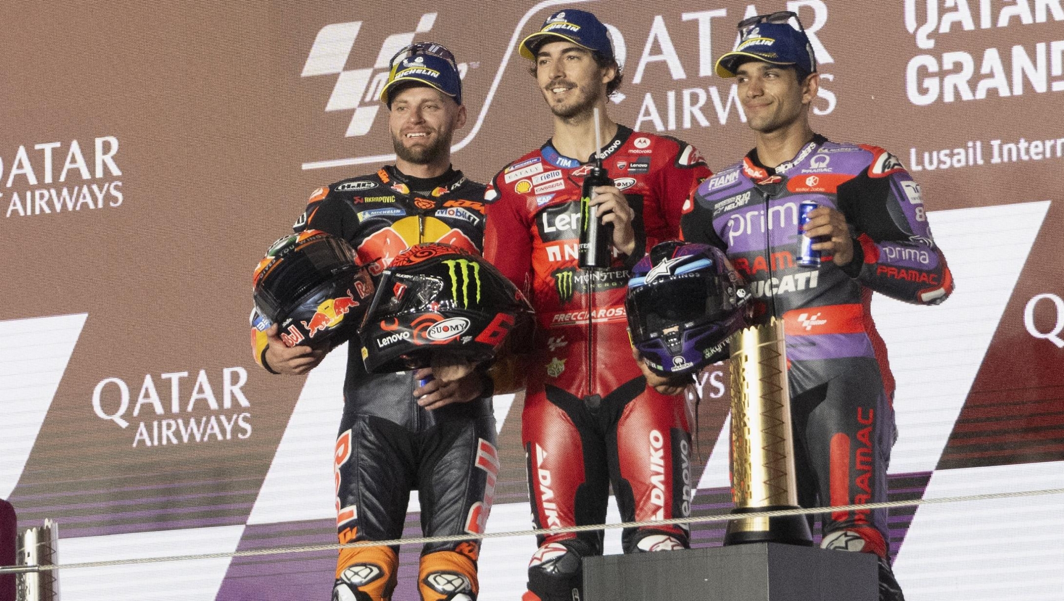 DOHA, QATAR - MARCH 10: (L-R) Brad Binder of South Africa and Red Bull KTM Factory Racing, Francesco Bagnaia of Italy and Ducati Lenovo Team and Jorge Martin of Spain and Prima Pramac Racing celebrate on the podium at the end of the MotoGP race  during the MotoGP Of Qatar - Race at Losail Circuit on March 10, 2024 in Doha, Qatar. (Photo by Mirco Lazzari gp/Getty Images)