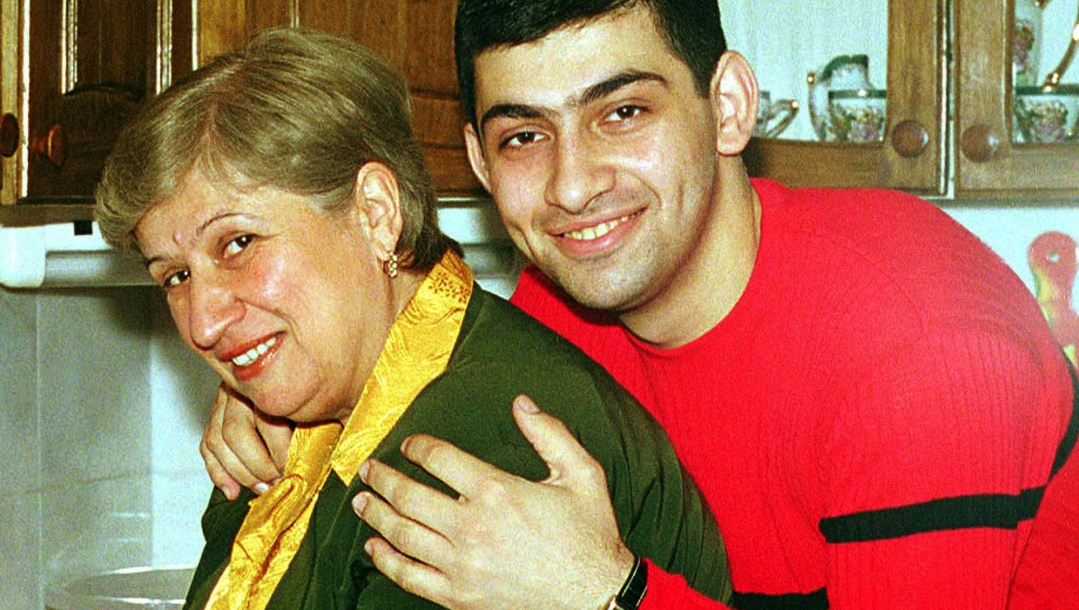 FILE--A family handout photo shows Levan Kaladze with his mother Medeya a few days before his kidnapping in Tbilisi, on  May 23 , 2001. Levan Kaladze, 20, brother of Kakha Kaladze, AC Milan's Georgian midfielder, was kidnapped on May 23. His kidnappers have reportedly demanded dlrs 600,000 for his freedom. (AP Photo) NO SALES