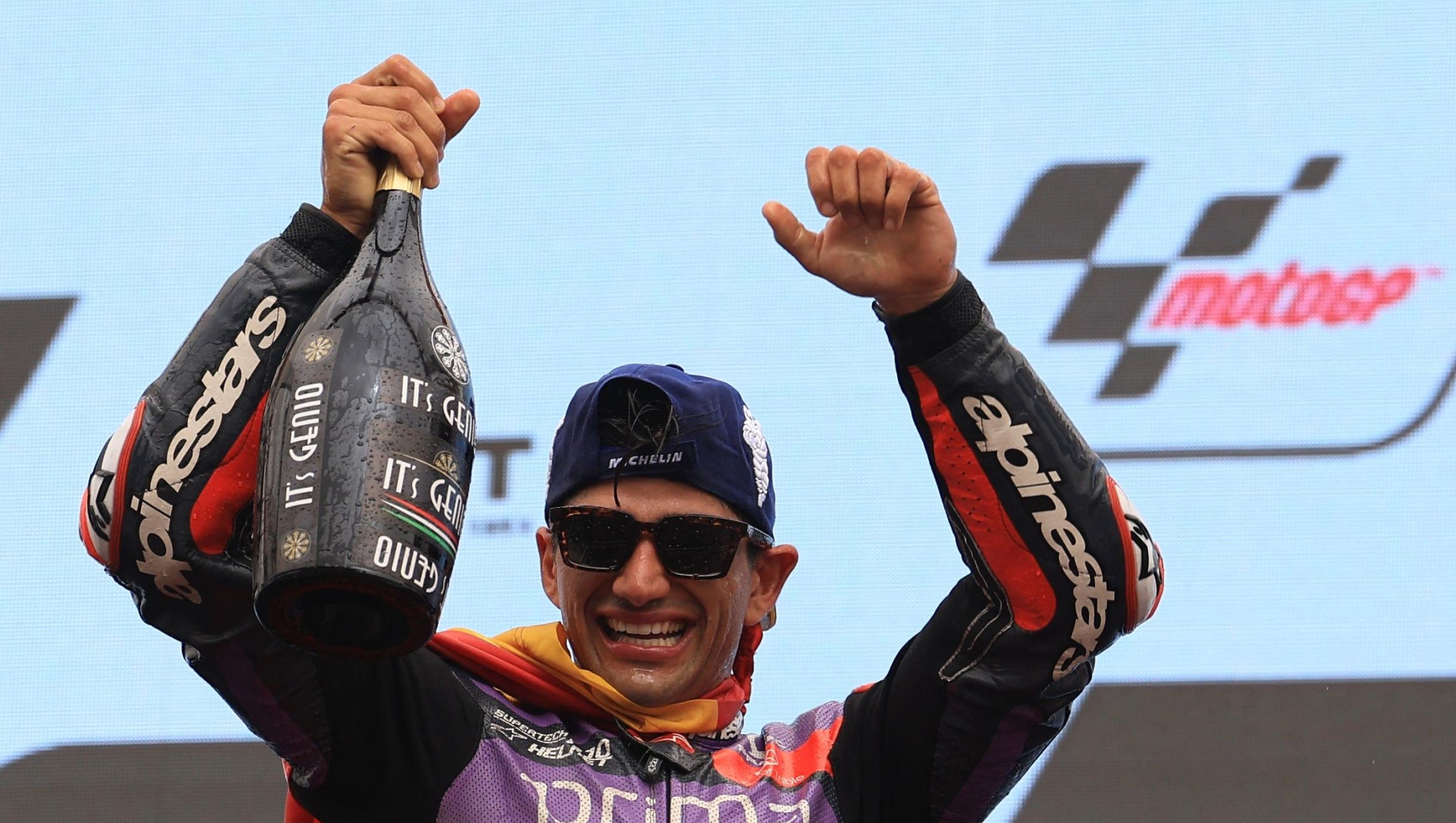 Ducati Spanish rider Jorge Martin celebrates on the podium after winning the MotoGP race of the Portuguese Grand Prix at the Algarve International Circuit in Portimao on March 24, 2024. (Photo by PATRICIA DE MELO MOREIRA / AFP)