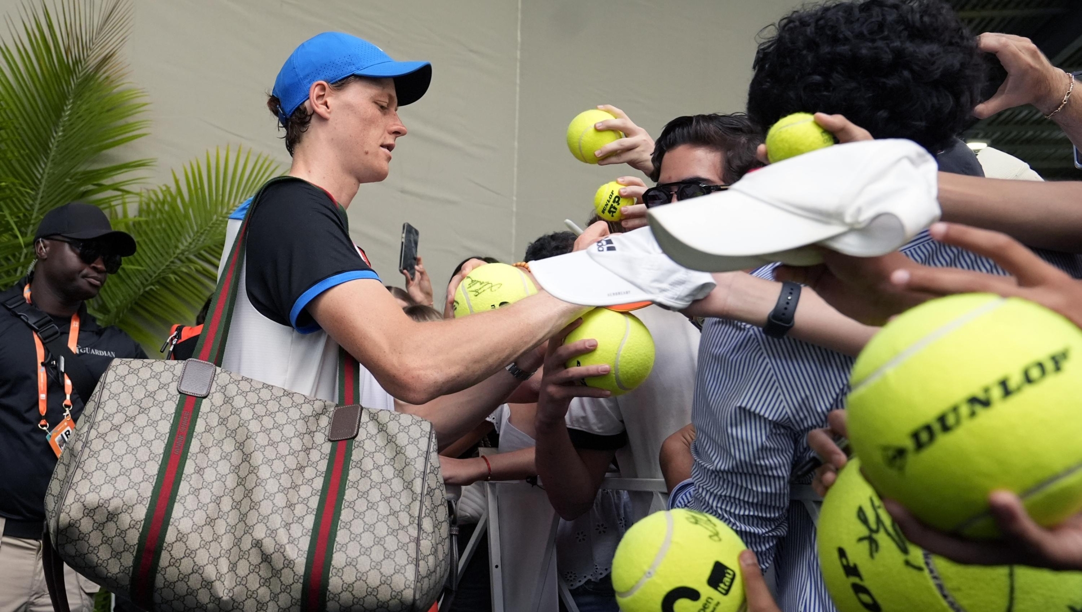 Jannik Sinner, of Italy, signs autographs during the Miami Open tennis tournament, Wednesday, March 27, 2024, in Miami Gardens, Fla. (AP Photo/Lynne Sladky)
