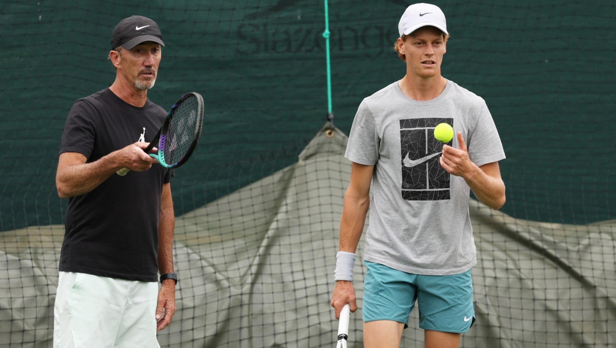 LONDON, ENGLAND - JUNE 27: Jannik Sinner of Italy talks with Coach, Darren Cahill during a practice session ahead of The Championships Wimbledon 2023 at All England Lawn Tennis and Croquet Club on June 27, 2023 in London, England. (Photo by Clive Brunskill/Getty Images)