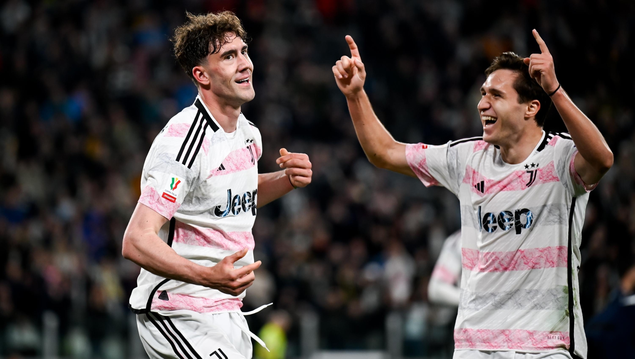 TURIN, ITALY - APRIL 02: Dusan Vlahovic of Juventus celebrates after scoring his team's second goal with teammate Federico Chiesa during the Coppa Italia Semi-final match between Juventus and SS Lazio at Allianz Stadium on April 02, 2024 in Turin, Italy. (Photo by Daniele Badolato - Juventus FC/Juventus FC via Getty Images)