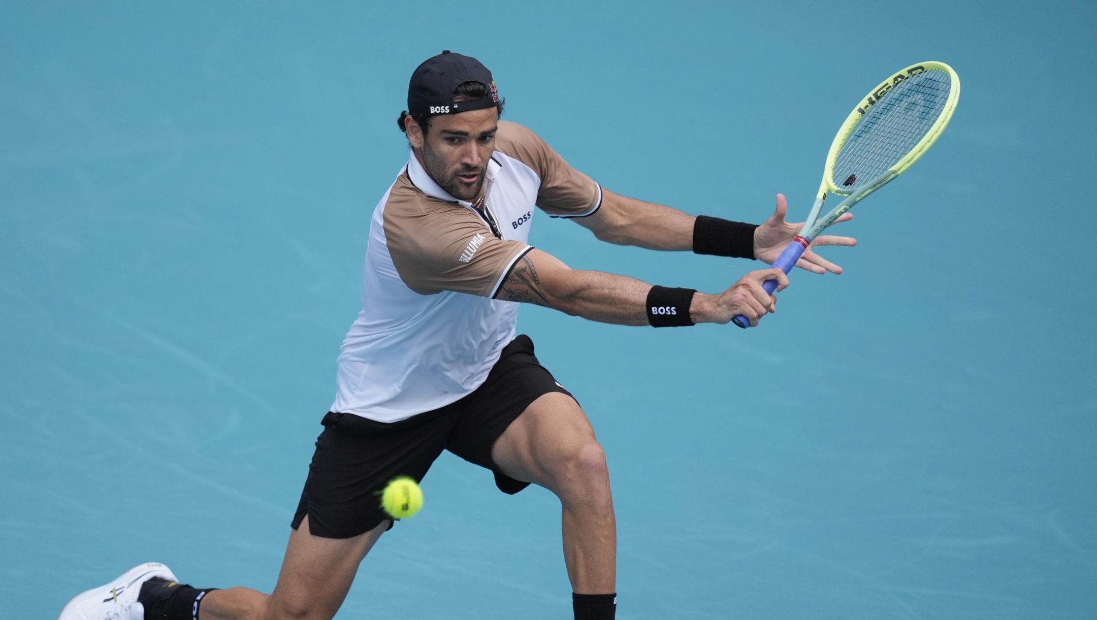 Matteo Berrettini, of Italy, returns a ball in his first round match against Andy Murray, of Britain, at the Miami Open tennis tournament, Wednesday, March 20, 2024, in Miami Gardens, Fla. (AP Photo/Rebecca Blackwell)