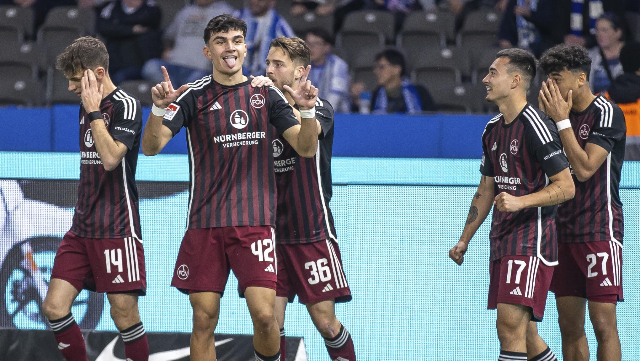 Nuremberg's Can Uzun, centre left, celebrates scoring a goal, during the Bundesliga second division soccer match between Hertha Berlin and Nuremberg, in Berlin, Saturday, March 30, 2024. One of Germany?s most exciting players isn?t even playing in the Bundesliga. Nuremberg teenager Can Uzun has 15 goals in the second division after scoring twice against Hertha Berlin this weekend. Only three players have more this season than the 18-year-old, whose performances have captured the attention of a host of clubs.  (Andreas Gora/dpa via AP)
