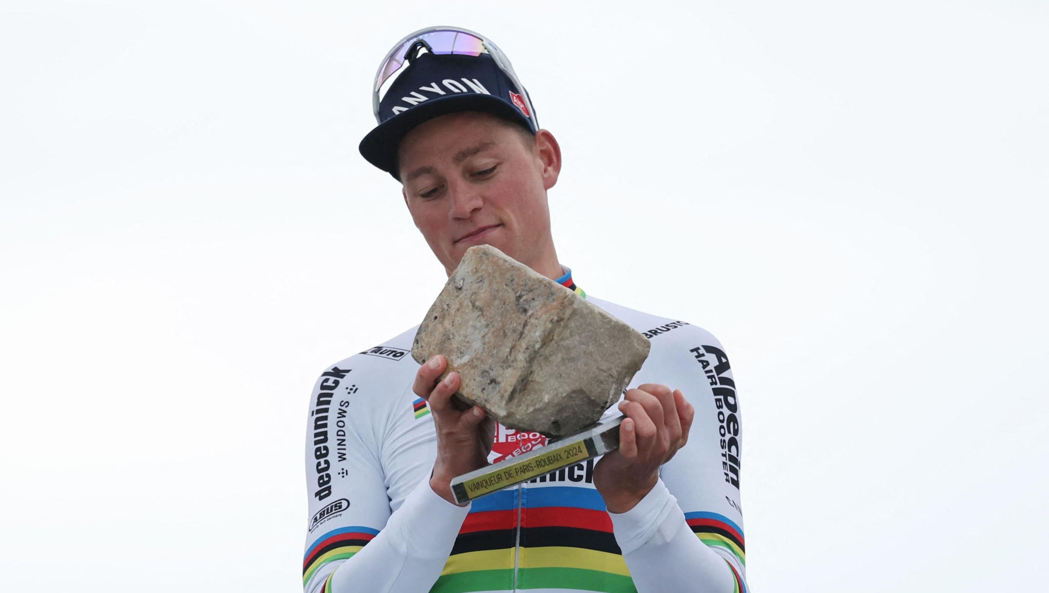 Alpecin - Deceuninck team's Dutch rider Mathieu Van Der Poel celebrates on the podium after winning the 121st edition of the Paris-Roubaix one-day classic cycling race, 260km between Compiegne and Roubaix, northern France, on April 7, 2024. (Photo by Francois LO PRESTI / AFP)