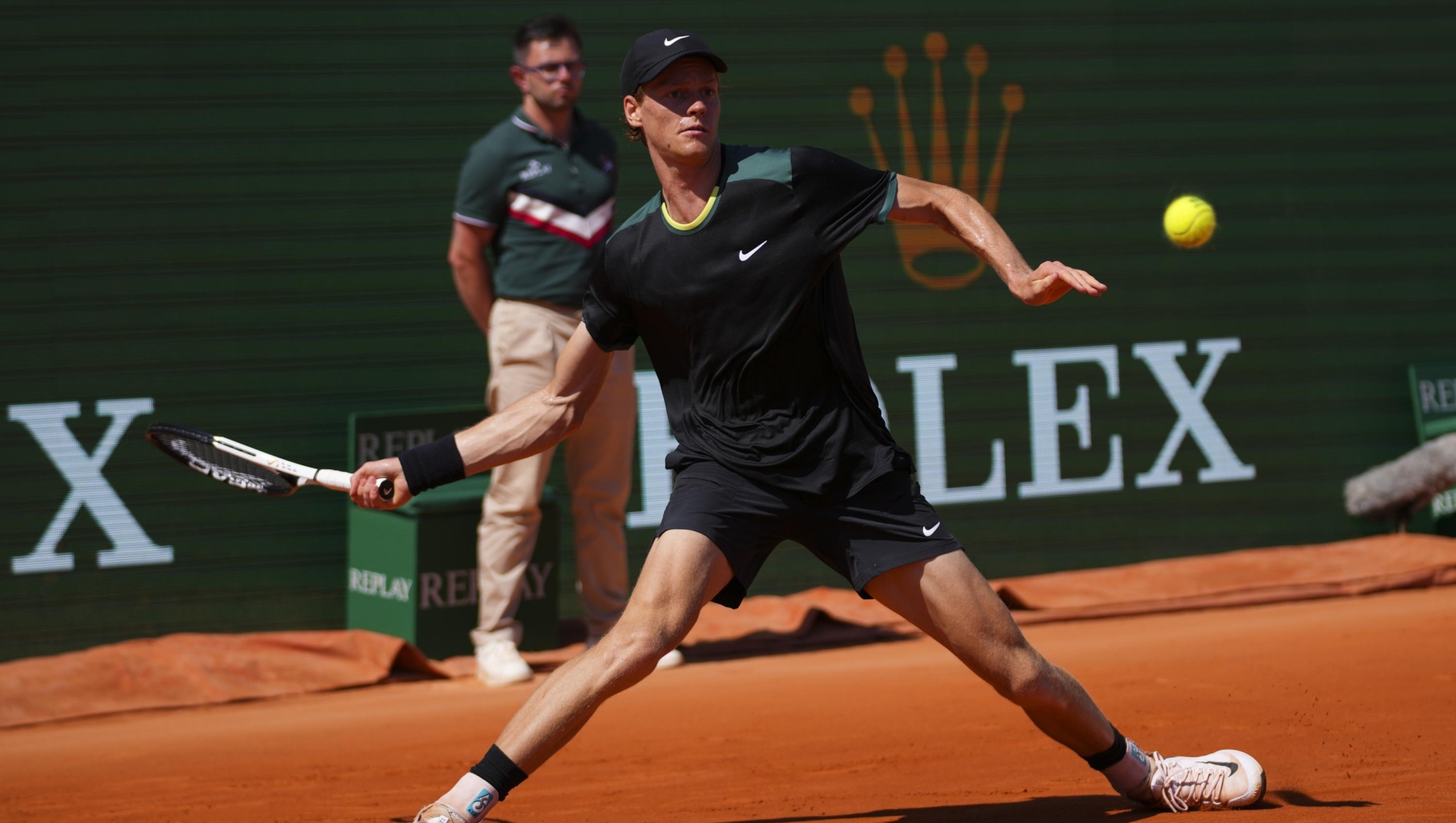 Jannik Sinner, of Italy returns the ball to Stefanos Tsitsipas, of Greece during their Monte Carlo Tennis Masters semifinal match in Monaco, Saturday, April 13, 2024. (AP Photo/Daniel Cole)