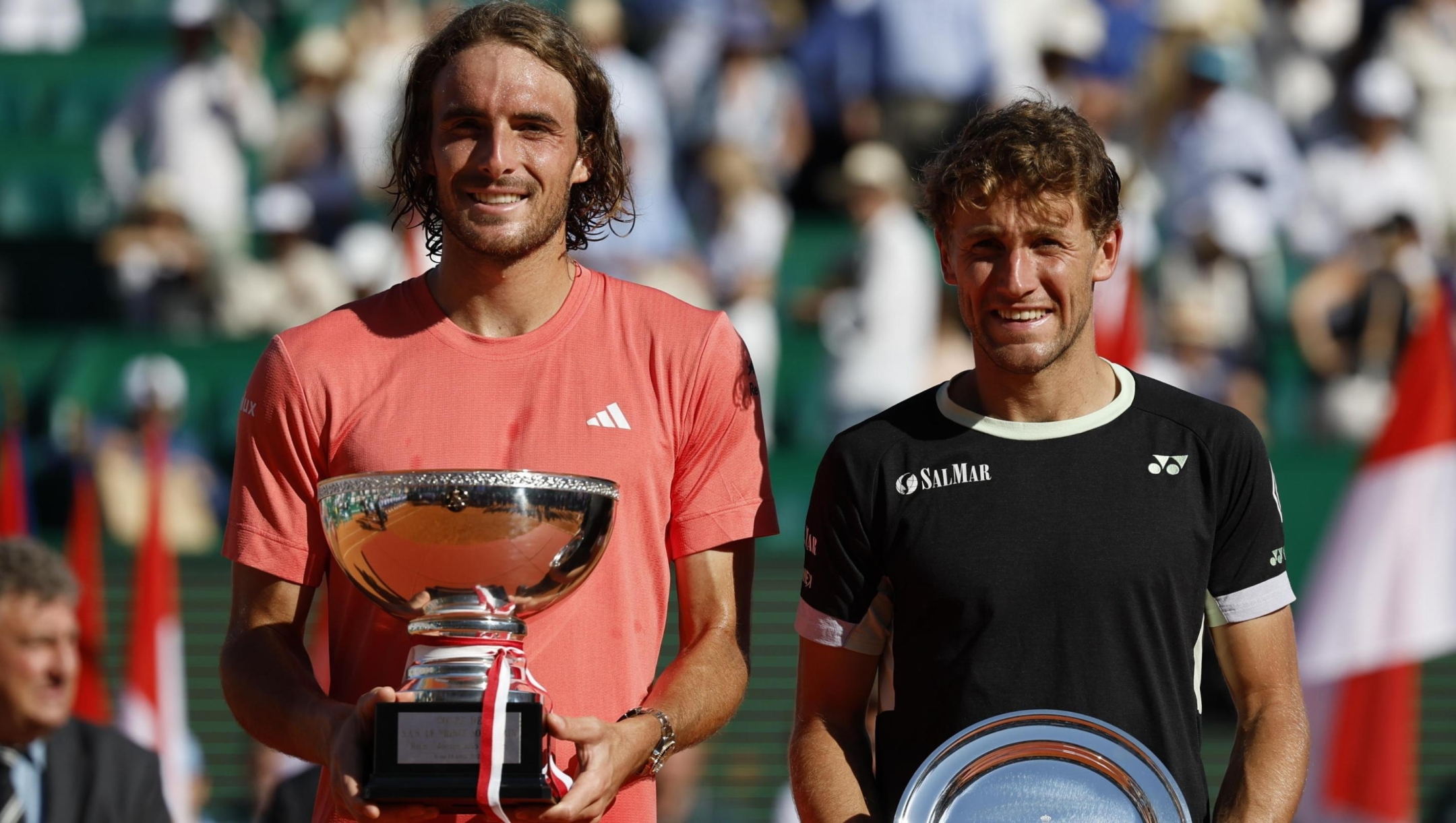 epa11278424 Stefanos Tsitsipas of Greece (L) poses with his trophy  next to Casper Ruud of Norway (R) after winning his final match against him in their final match at the ATP Monte Carlo Masters tournament in Roquebrune Cap Martin, France, 14 April 2024.  EPA/Sebastien Nogier