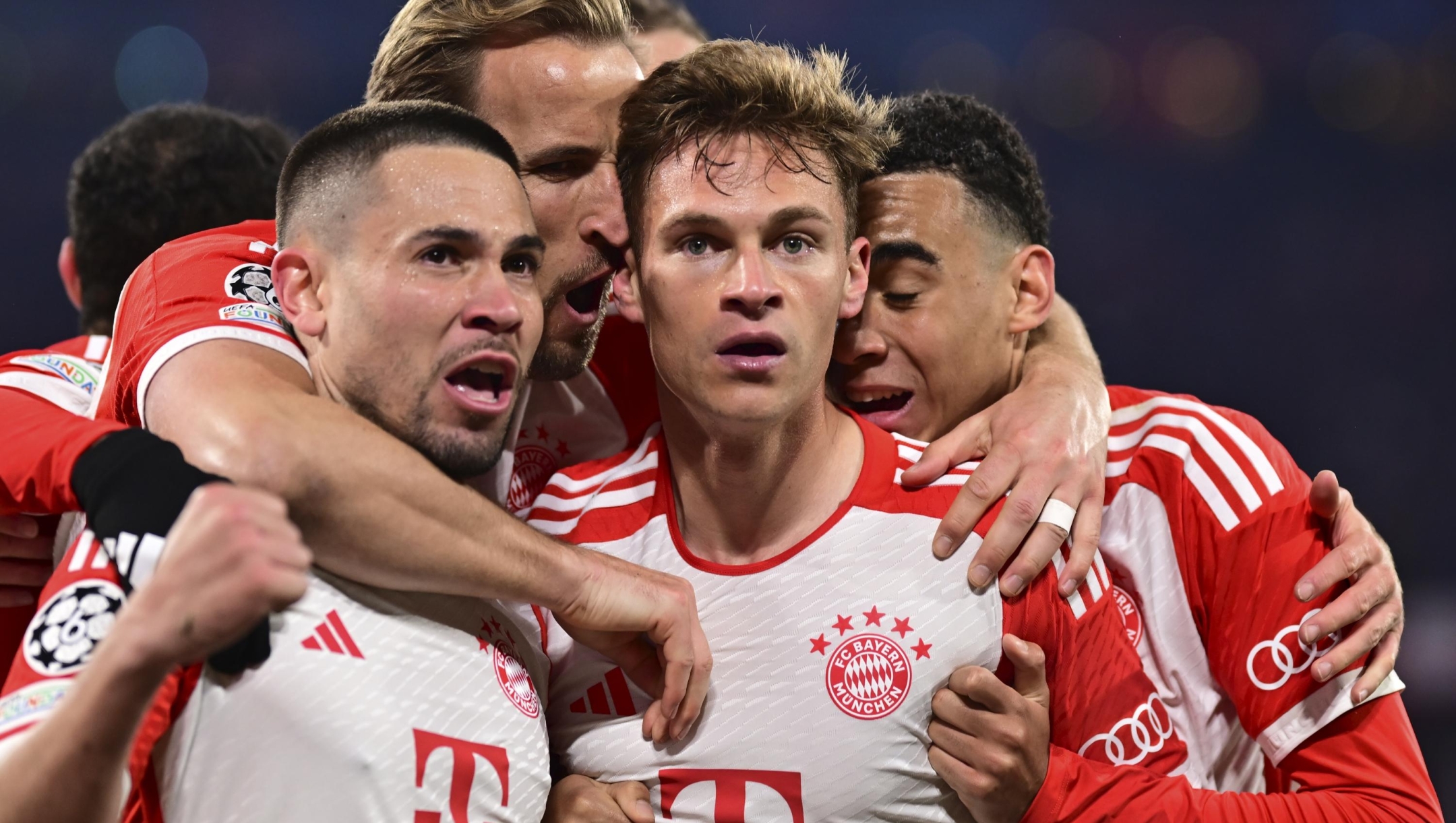 Bayern's Joshua Kimmich, centre, celebrates with teammates after scoring his side's opening goal during the Champions League quarter final second leg soccer match between Bayern Munich and Arsenal at the Allianz Arena in Munich, Germany, Wednesday, April 17, 2024. (AP Photo/Christian Bruna)